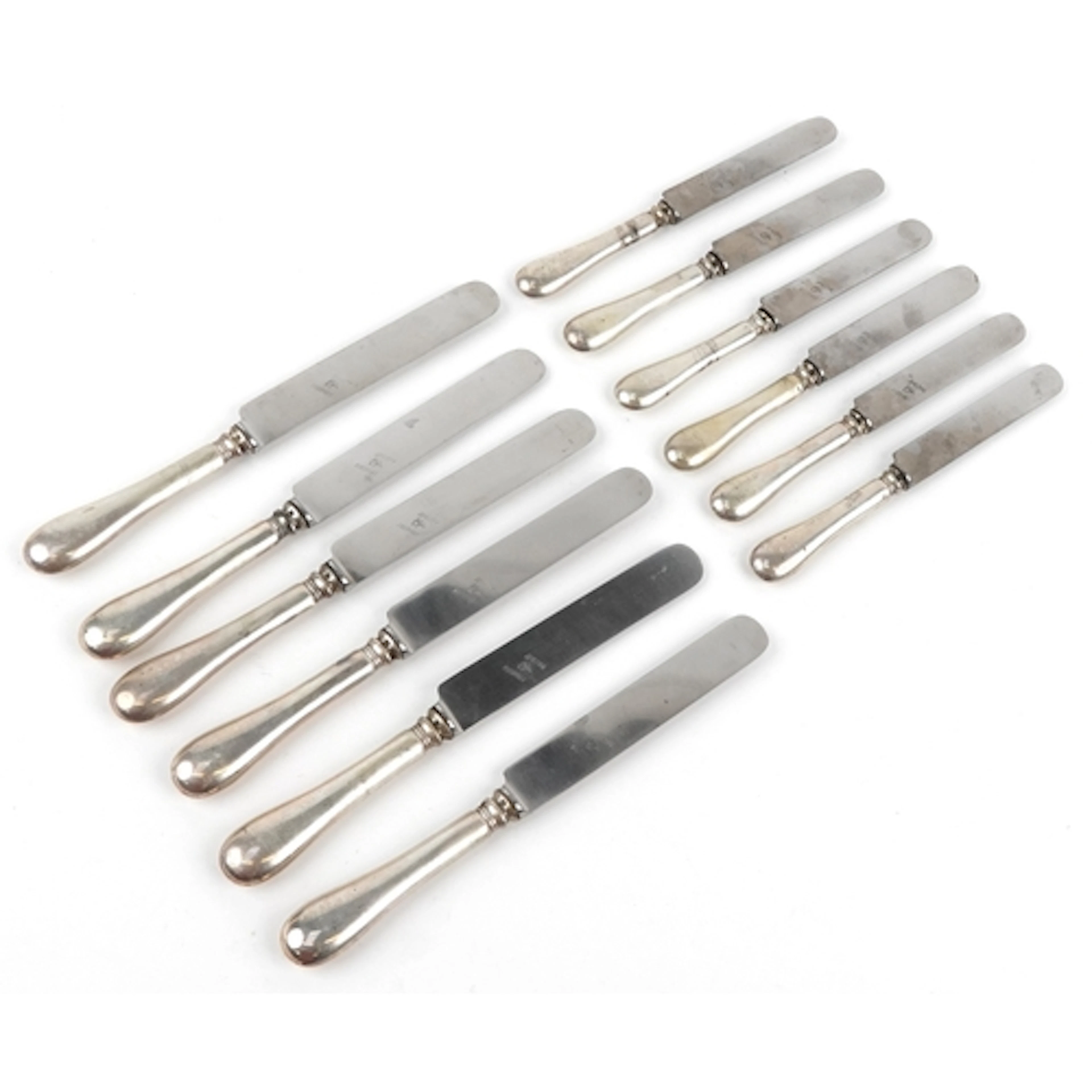 Two sets of six German knives having silver cased handles an...