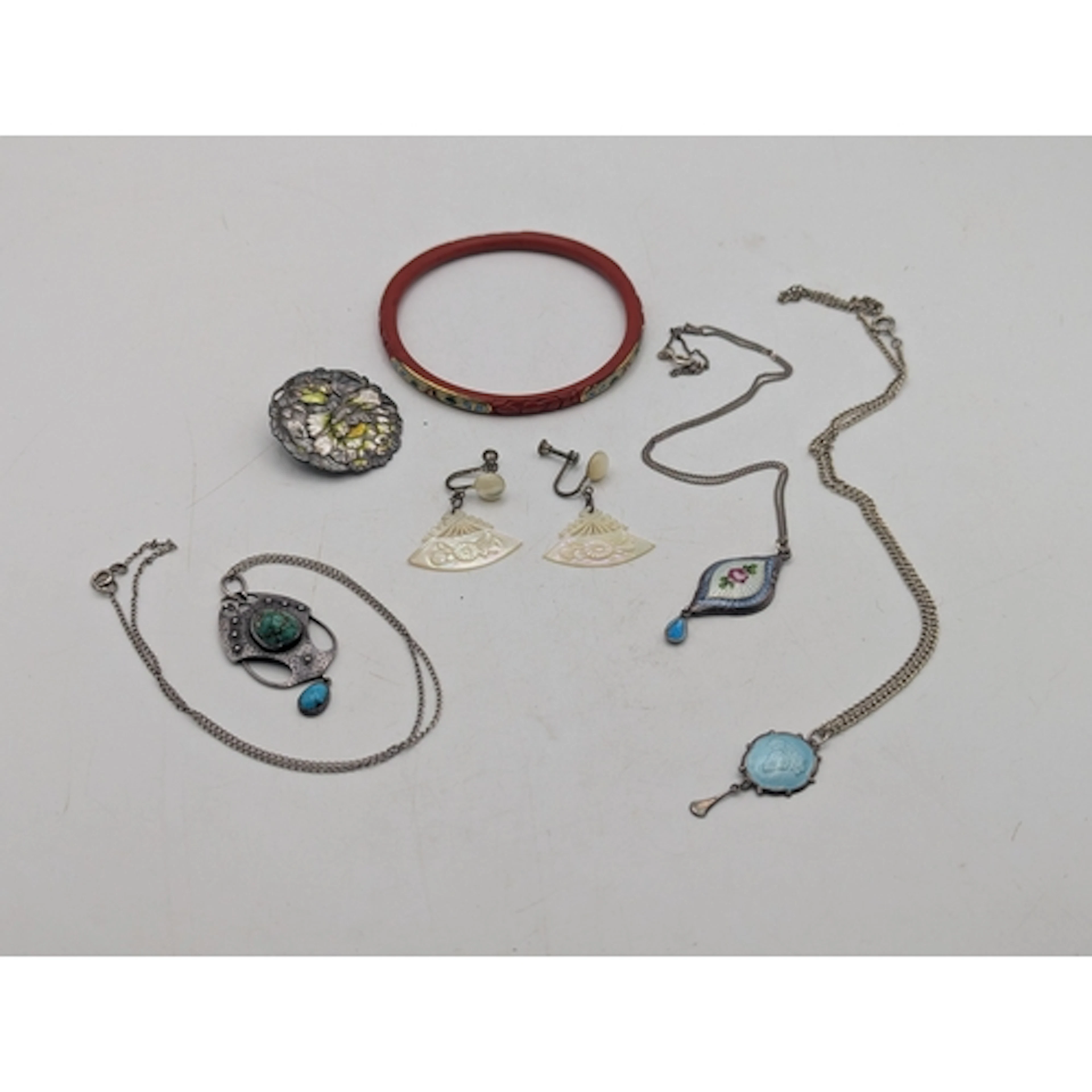 A small group of silver and other jewellery to include an Ar...