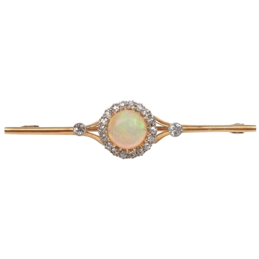 An Edwardian opal and diamond bar brooch, early 20th century...