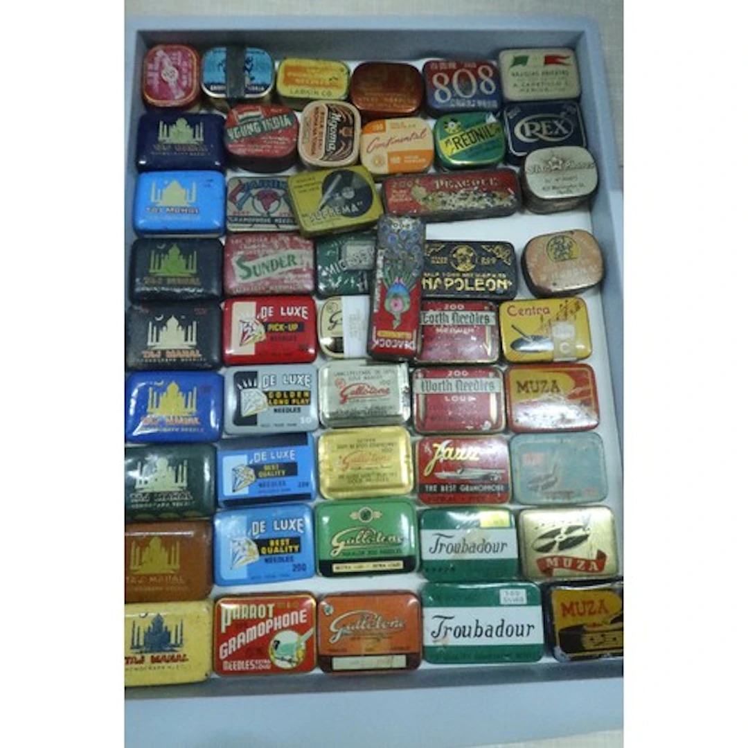A tray of vintage gramophone needle tins
