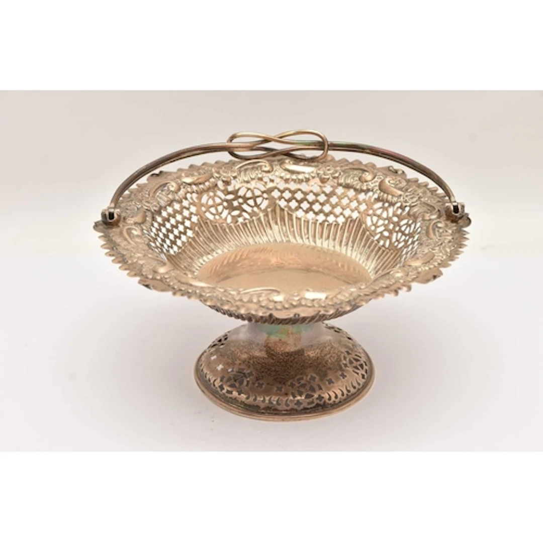 A LATE VICTORIAN SILVER SWING HANDLE PEDESTAL DISH, embossed...