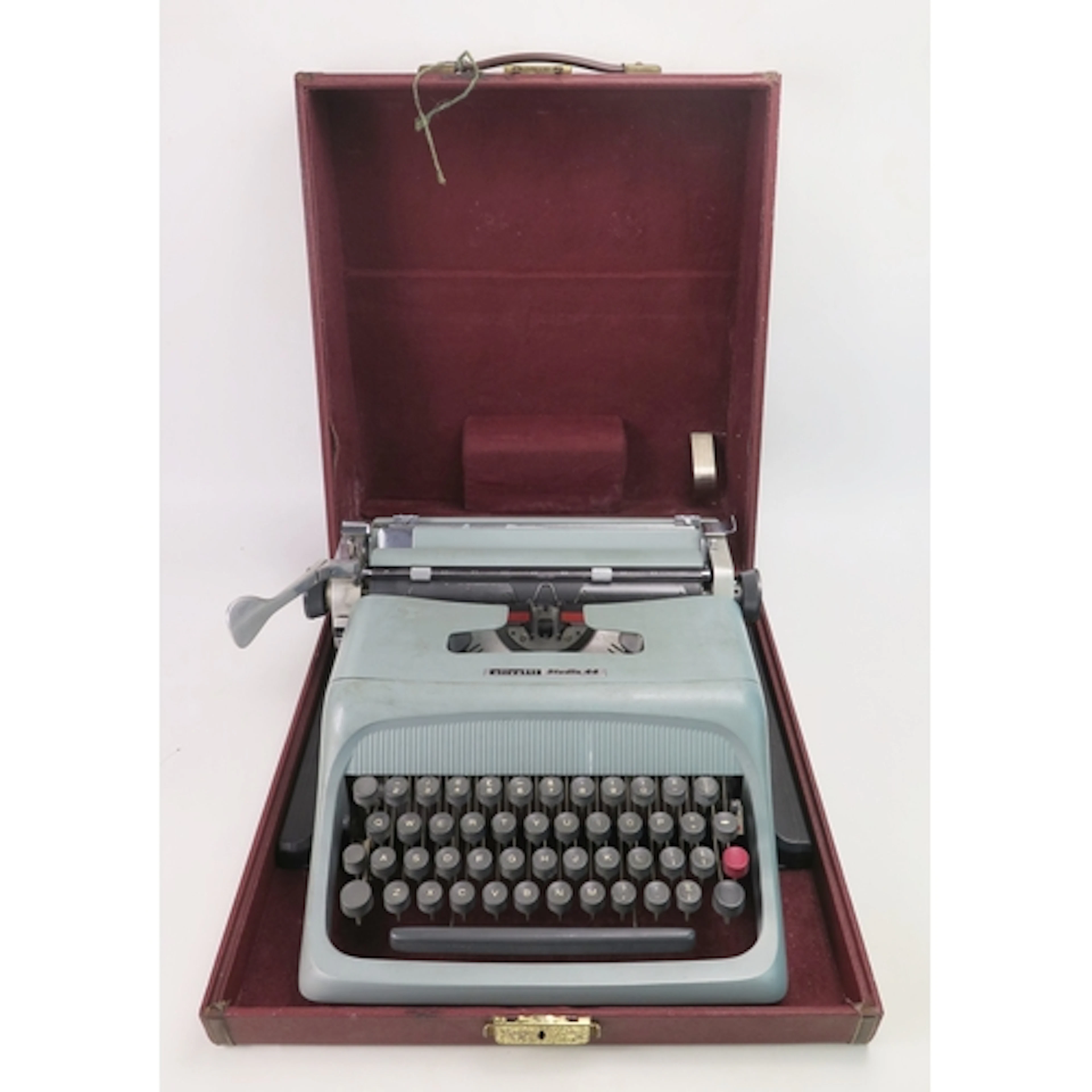 An Olivetti Studio 44 portable typewriter. Cased
