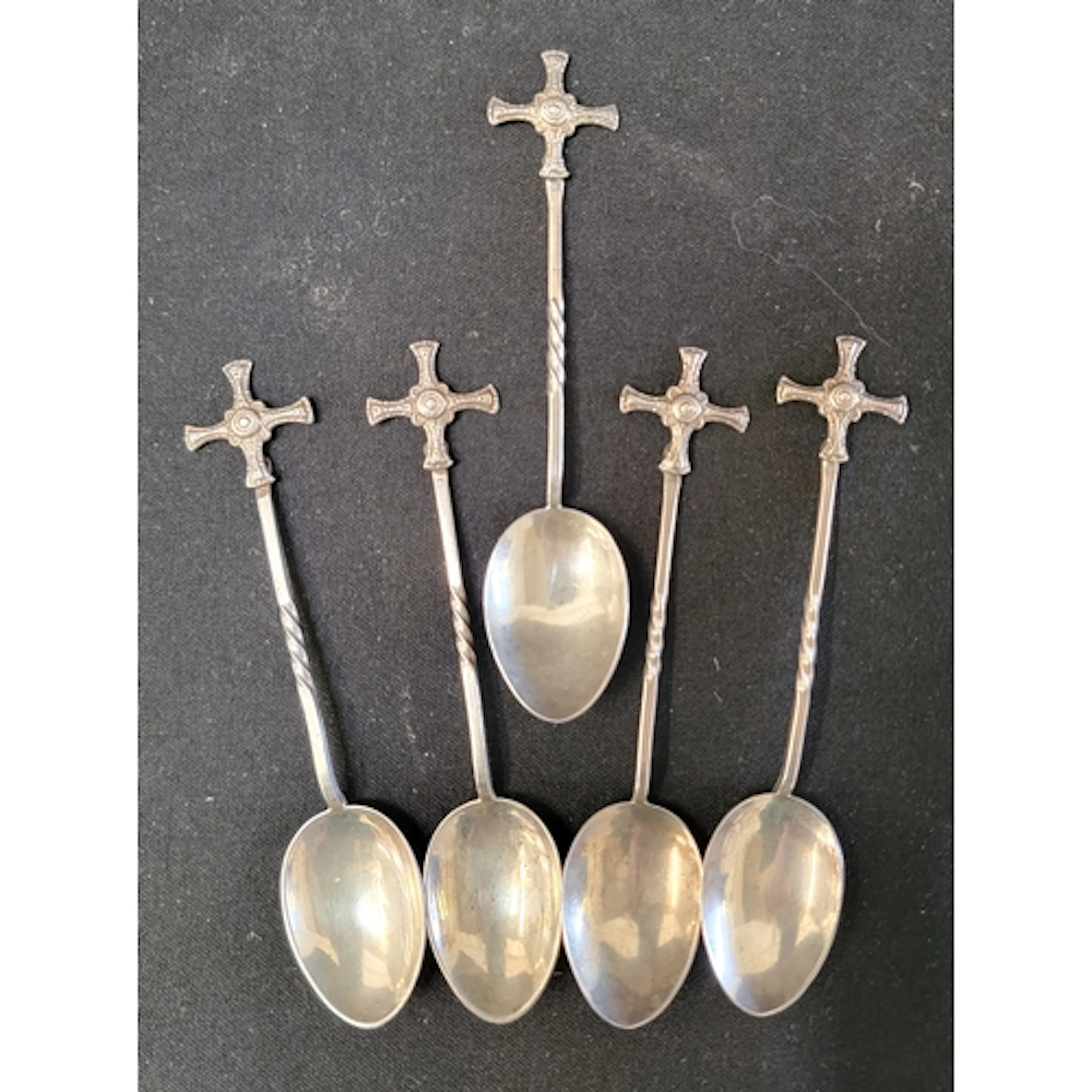 FIVE ST CUTHBERT'S CROSS CHRISTENING SPOONS featuring cross...