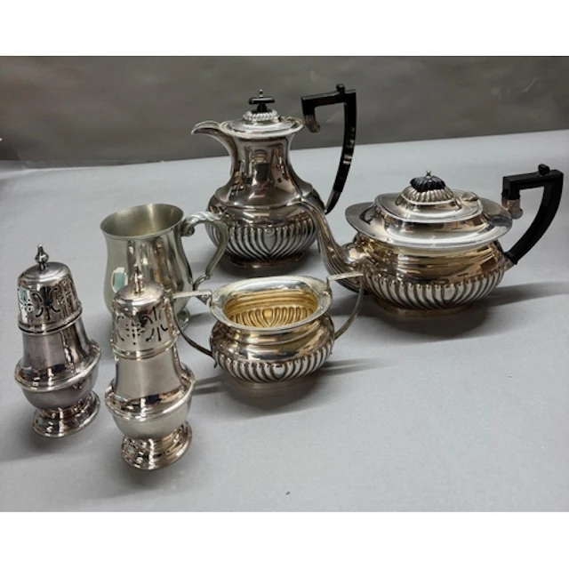 A selection of silverplate to include tea service, sugar sif...