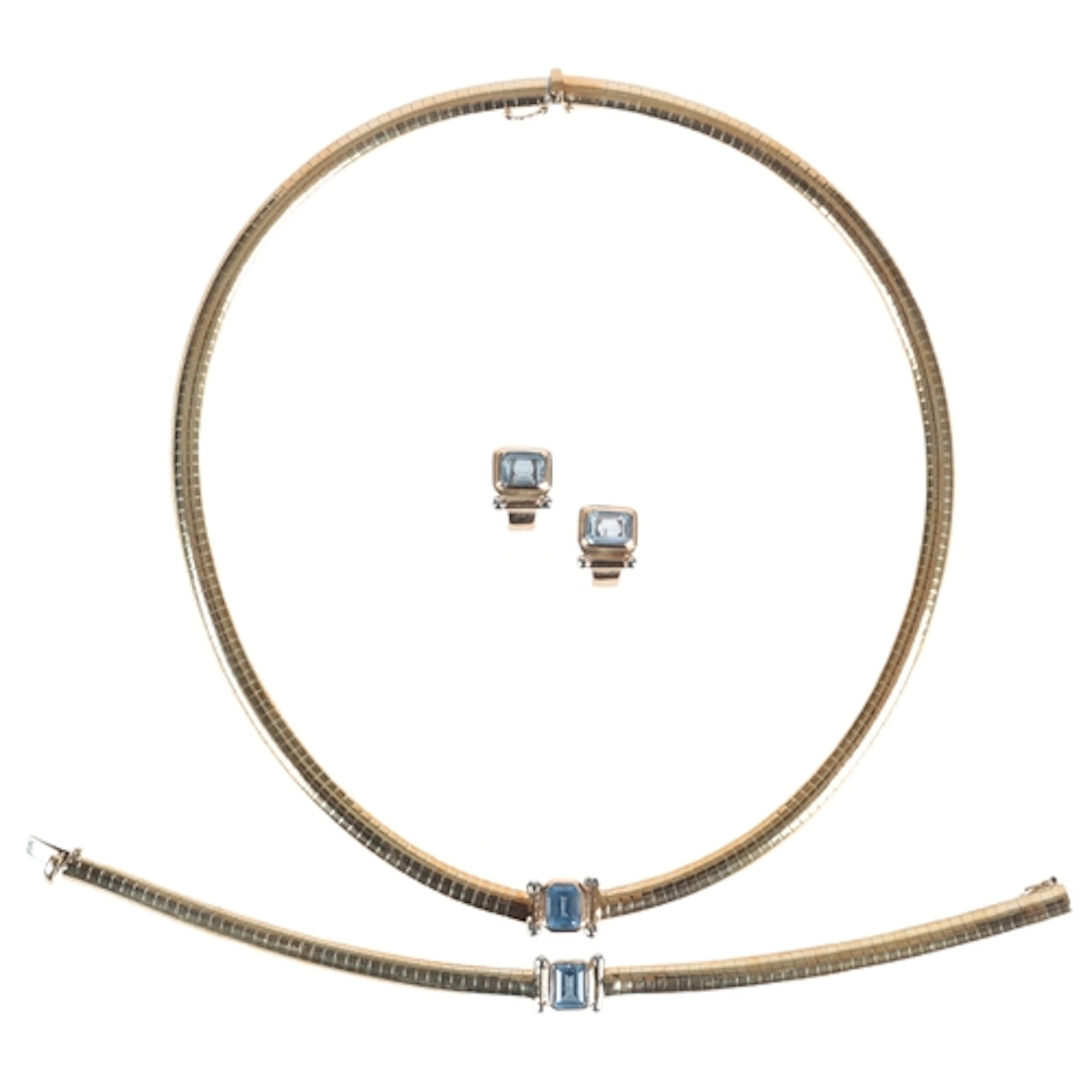 A gold and synthetic spinel parure, comprising: a necklace, ...