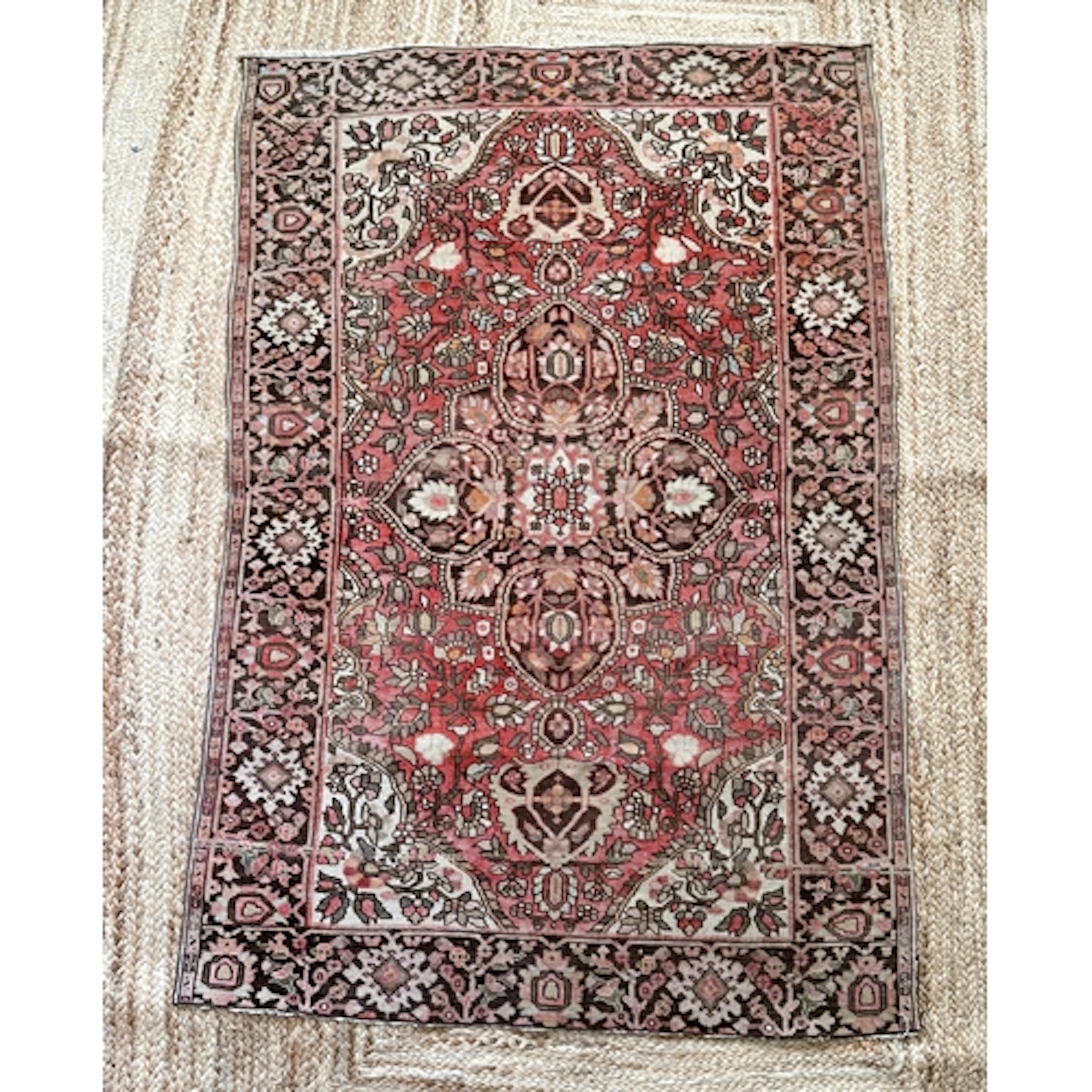An antique Persian small hand knotted wool rug, probably Her...