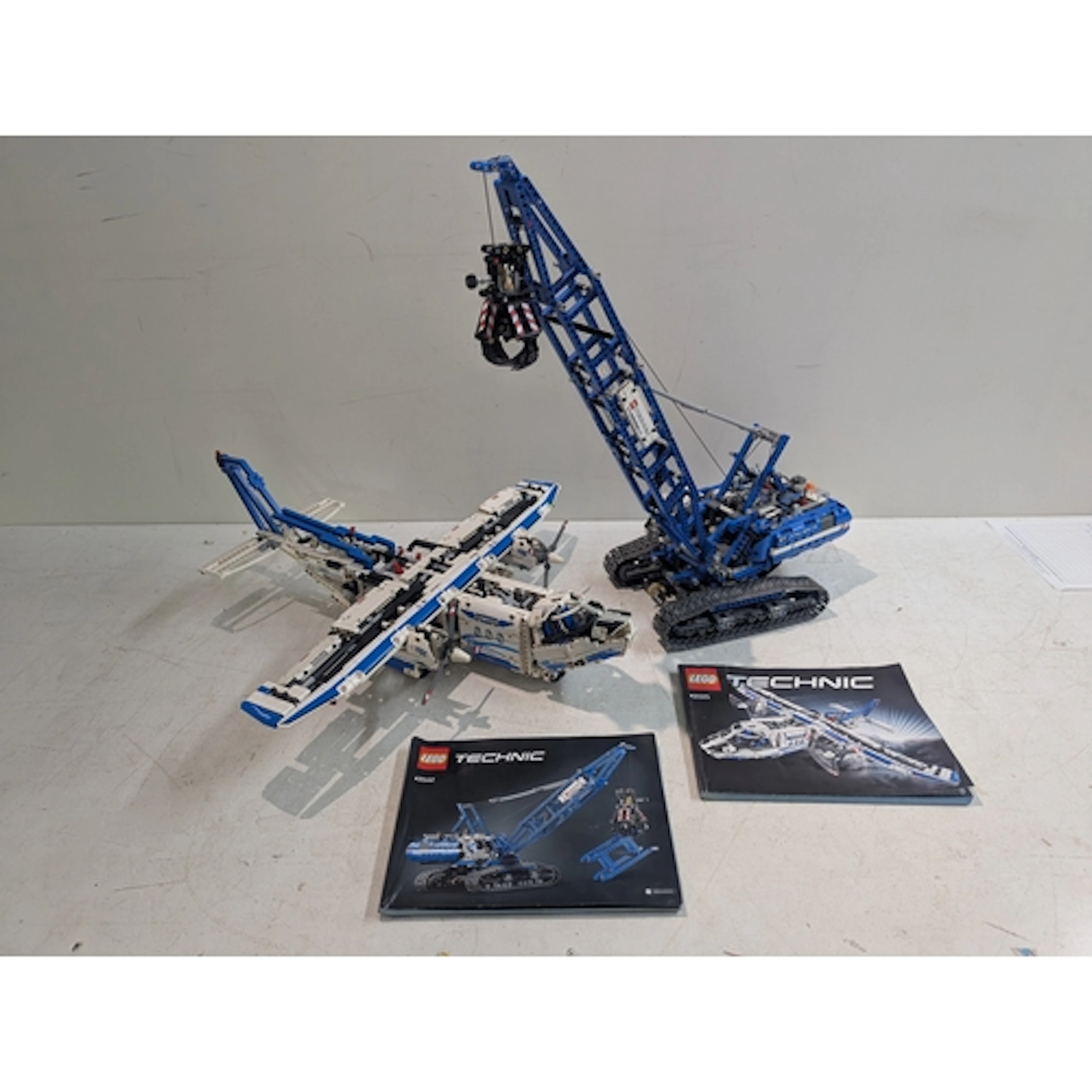Two Lego models to include a Cargo plane 42025 and a Crawler...