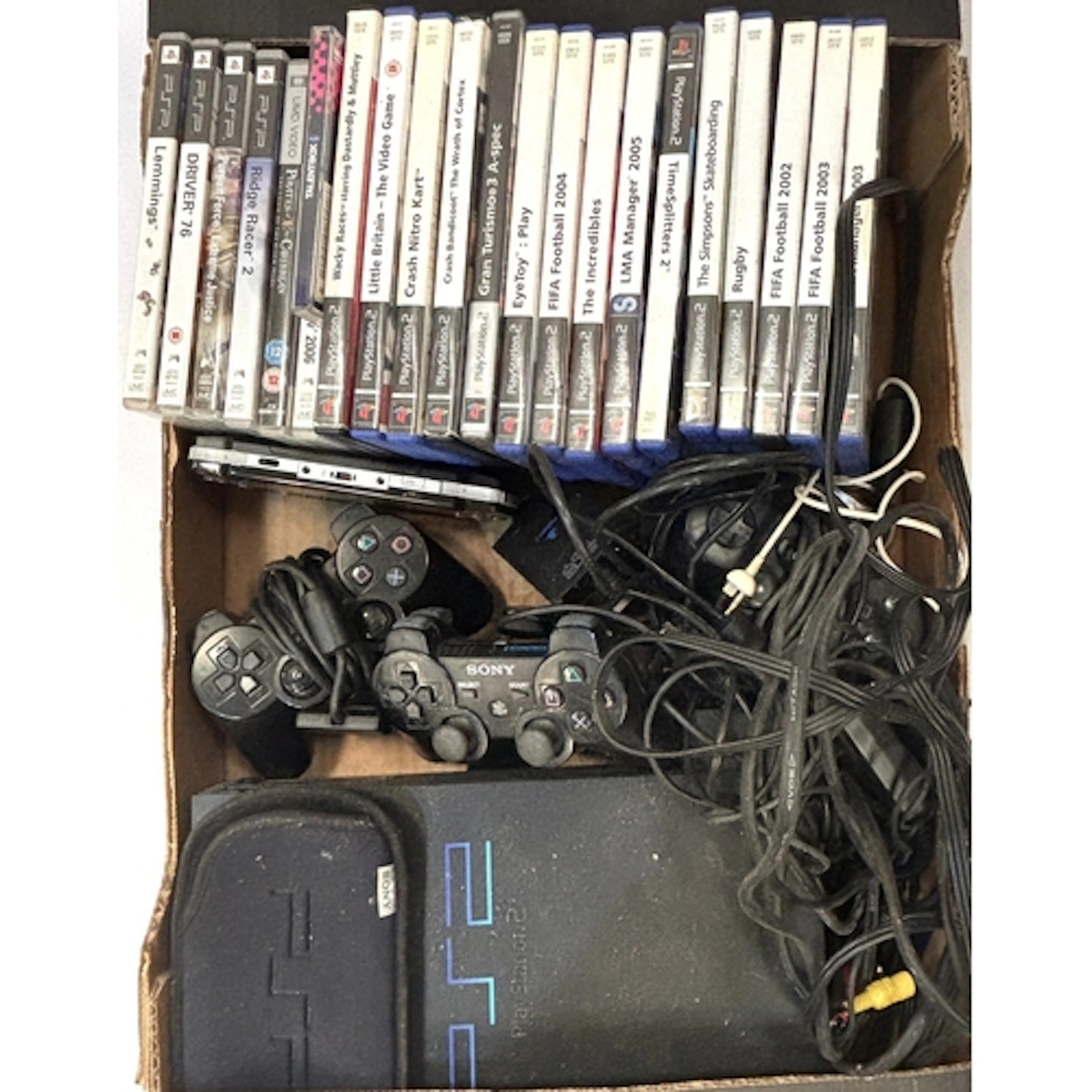 PlayStation 2 with games, eye toy control panel and memory c...