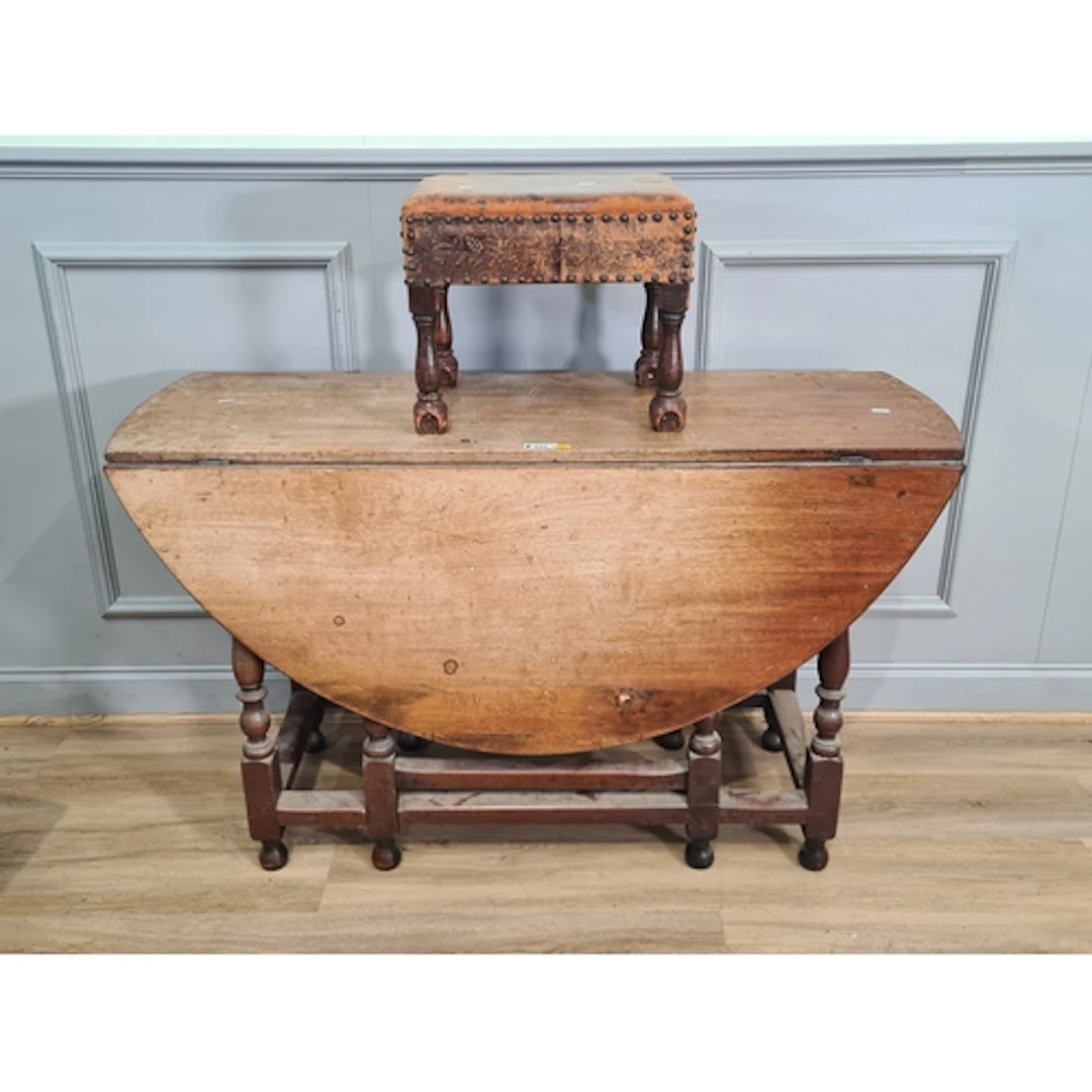 An oak Gateleg Table and a leather upholstered Footstool, (R...