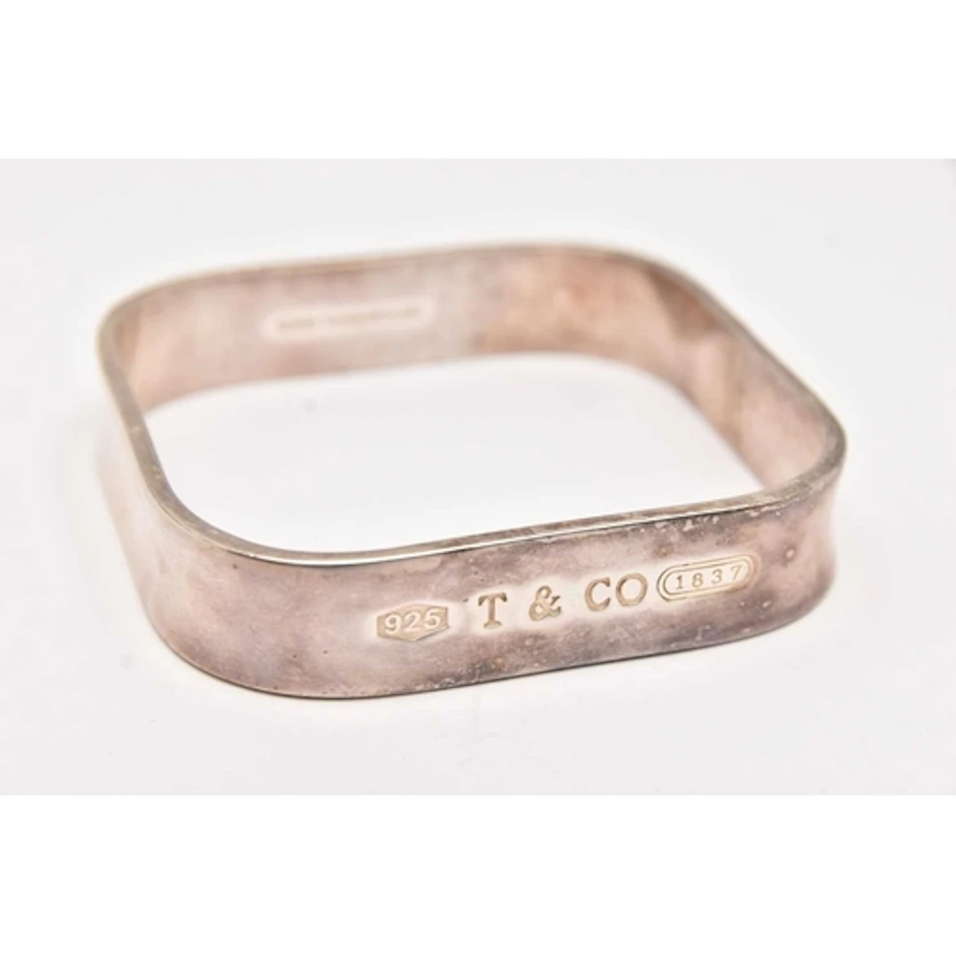 A 'TIFFANY & CO' SQUARE BANGLE, stamped to the outer ban...
