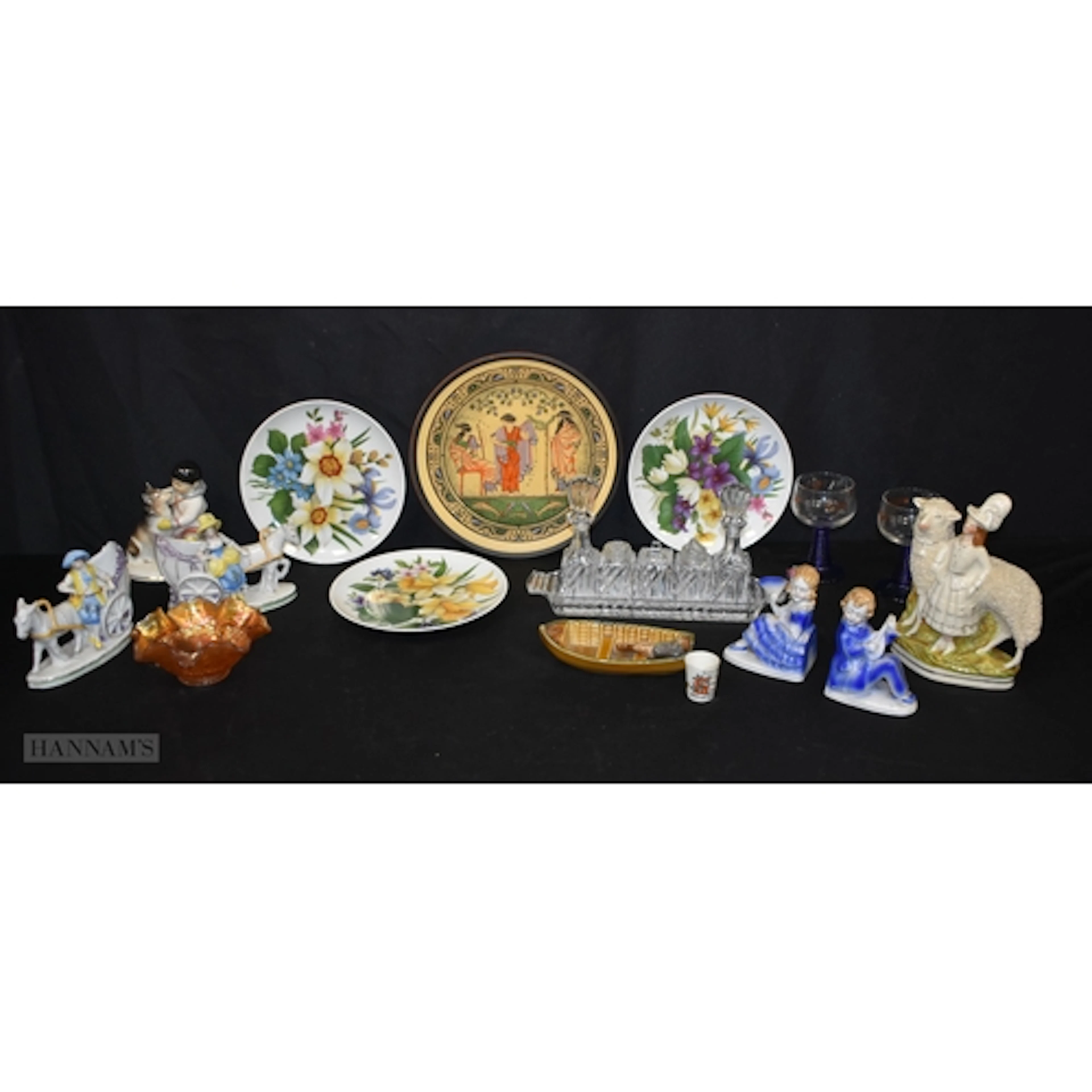 A 19th Century Staffordshire figure of a woman with a sheep ...