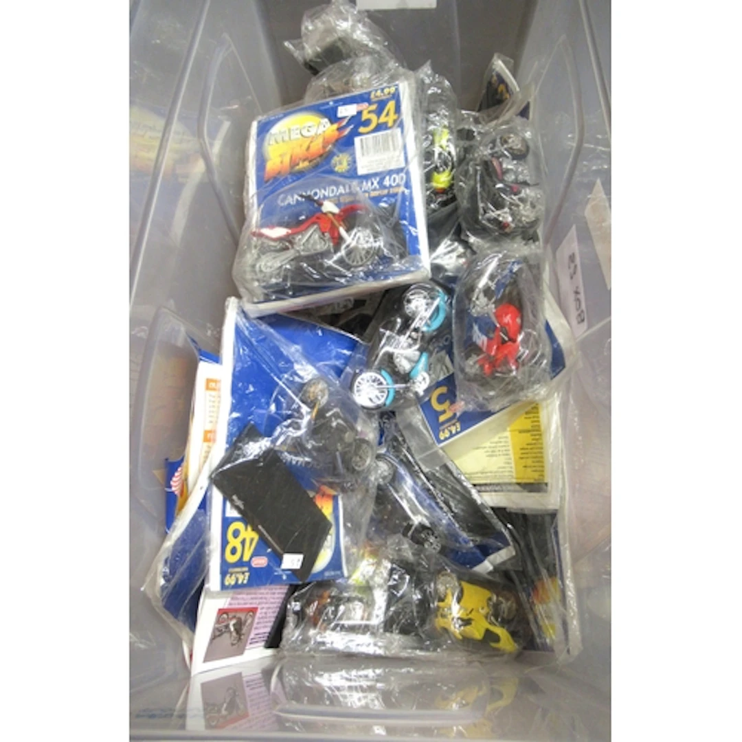 Box containing a quantity of model motorcycles