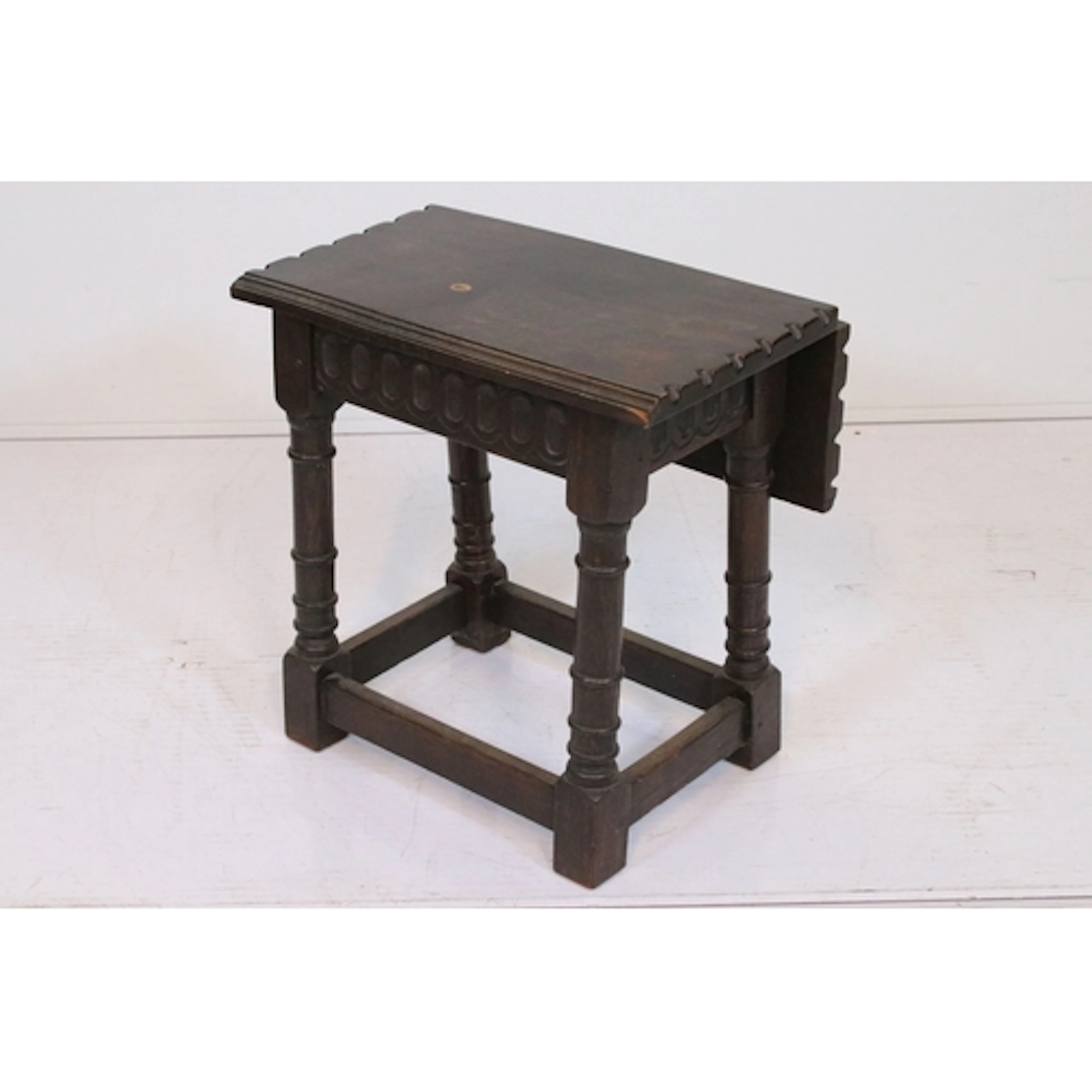 19th century oak joint stool, having drop flap top on carved...