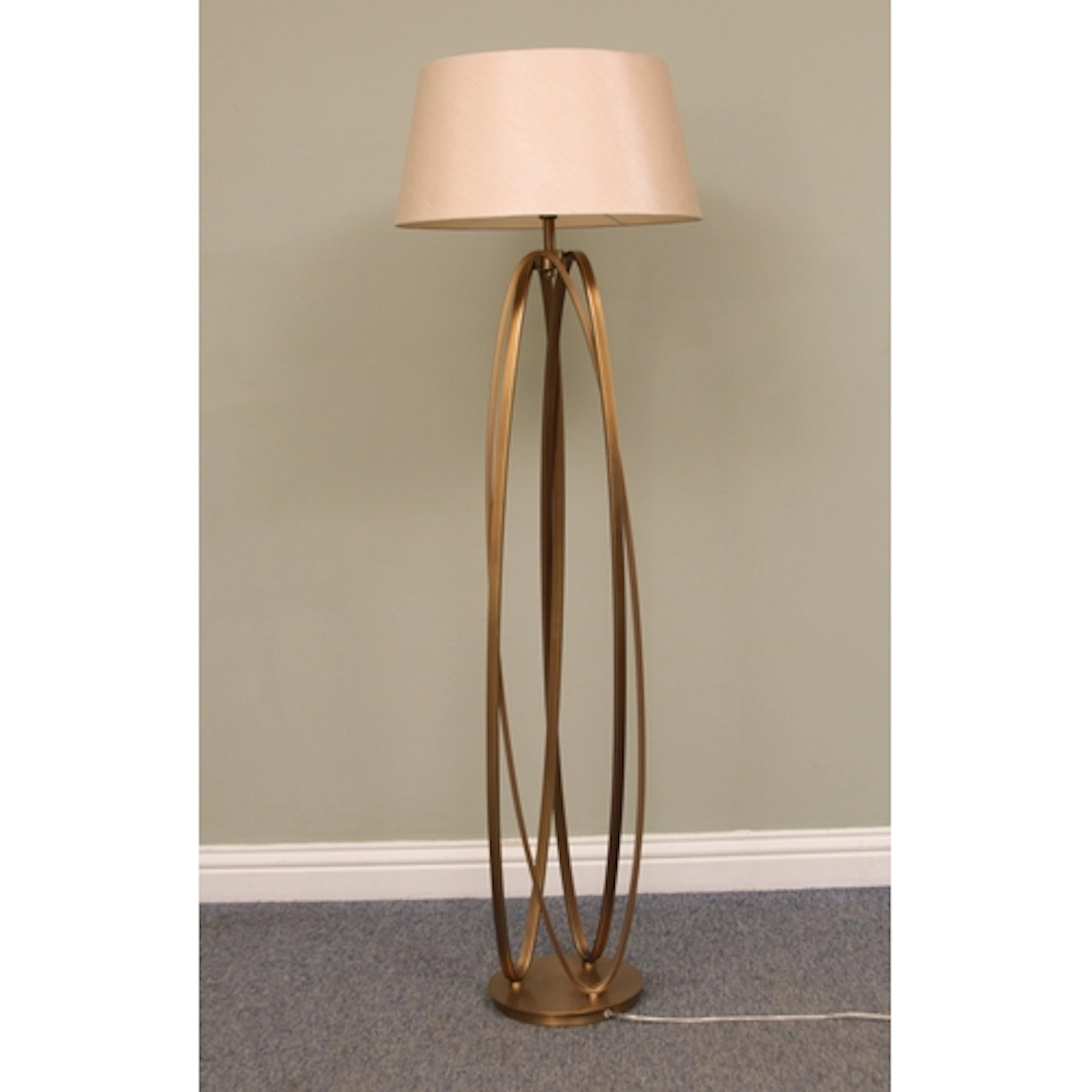 A Brisa antiqued brass standard floor lamp - formed by three...