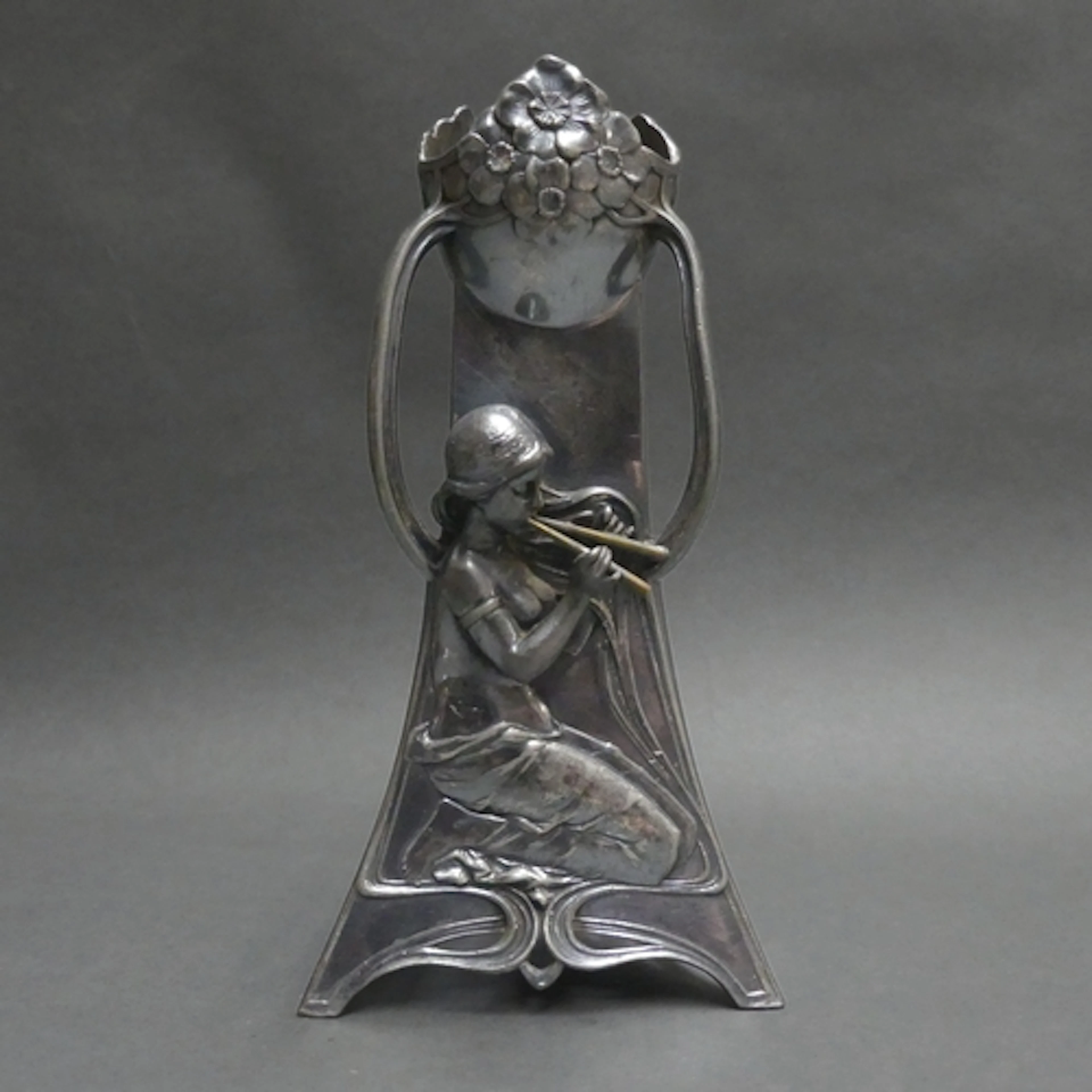 WMF - An Art Nouveau silver plated Britannia metal shaped va...