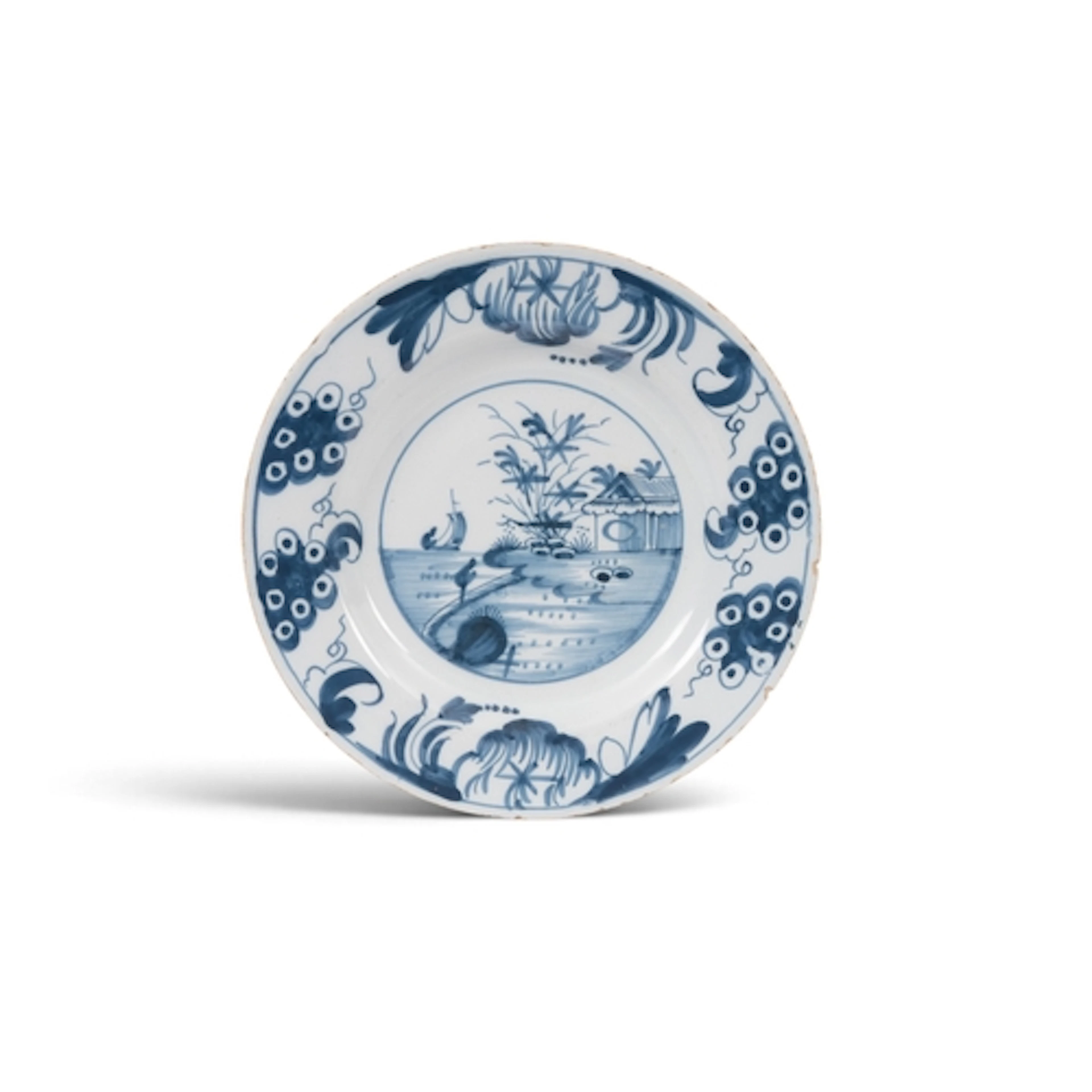 A rare Glasgow 'Delftfield' delftware plate, c.1760, painted...