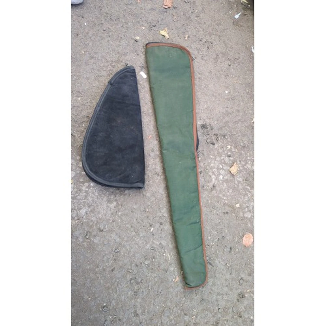 Two padded zippered gun cases: a long green fabric rifle or ...
