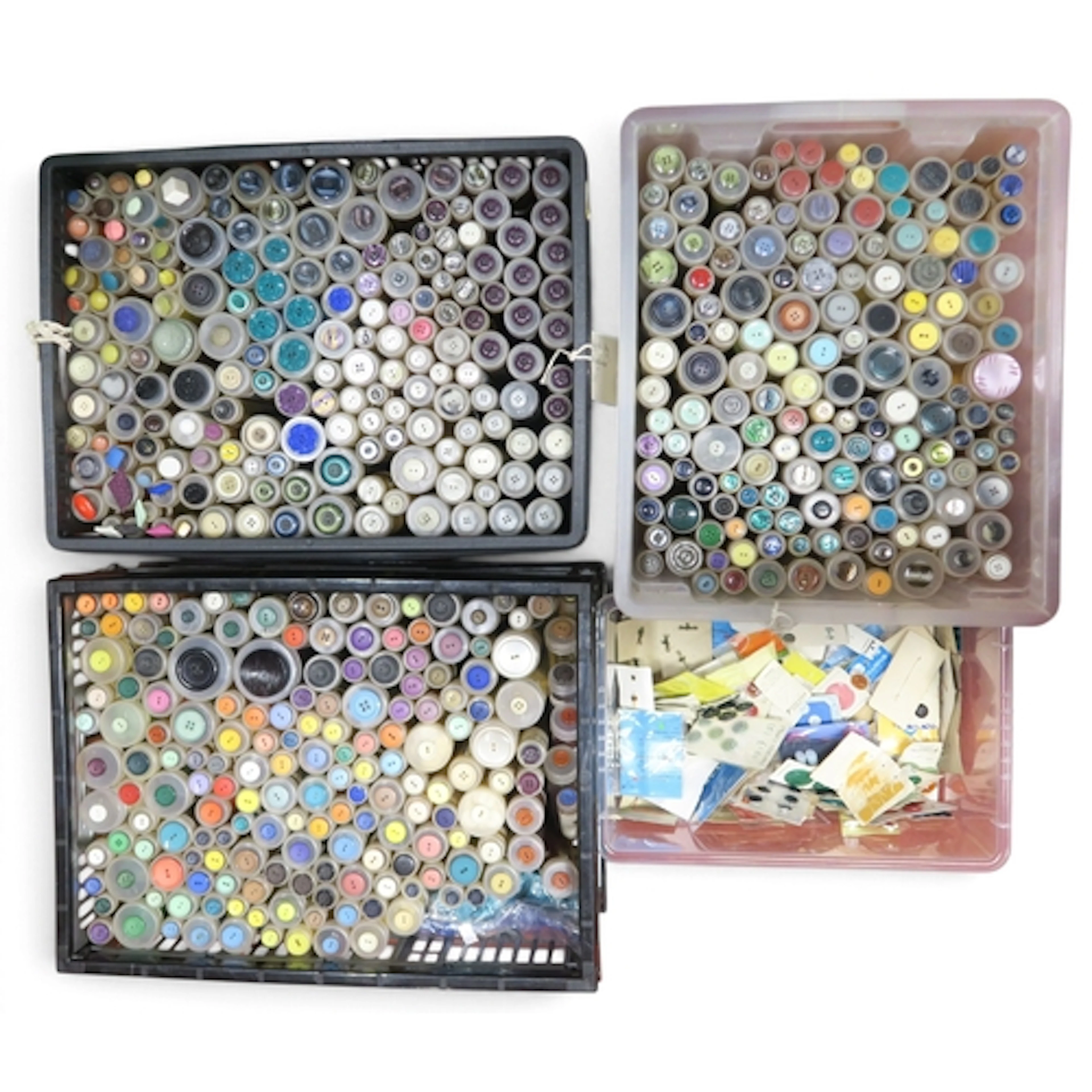 A large collection of mostly flat vintage buttons in a varie...