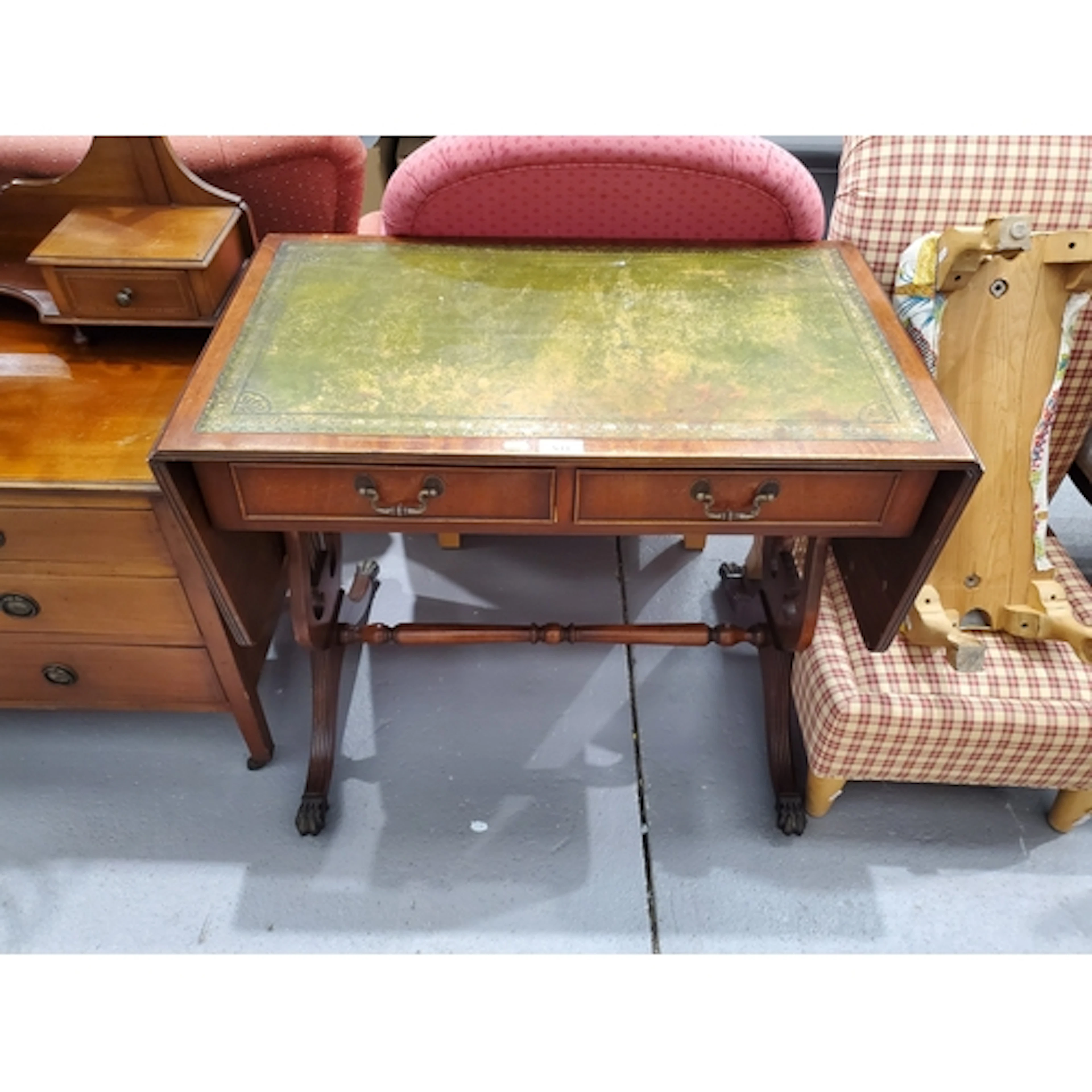 A drop end Sofa Table with leather inset top fitted two shor...