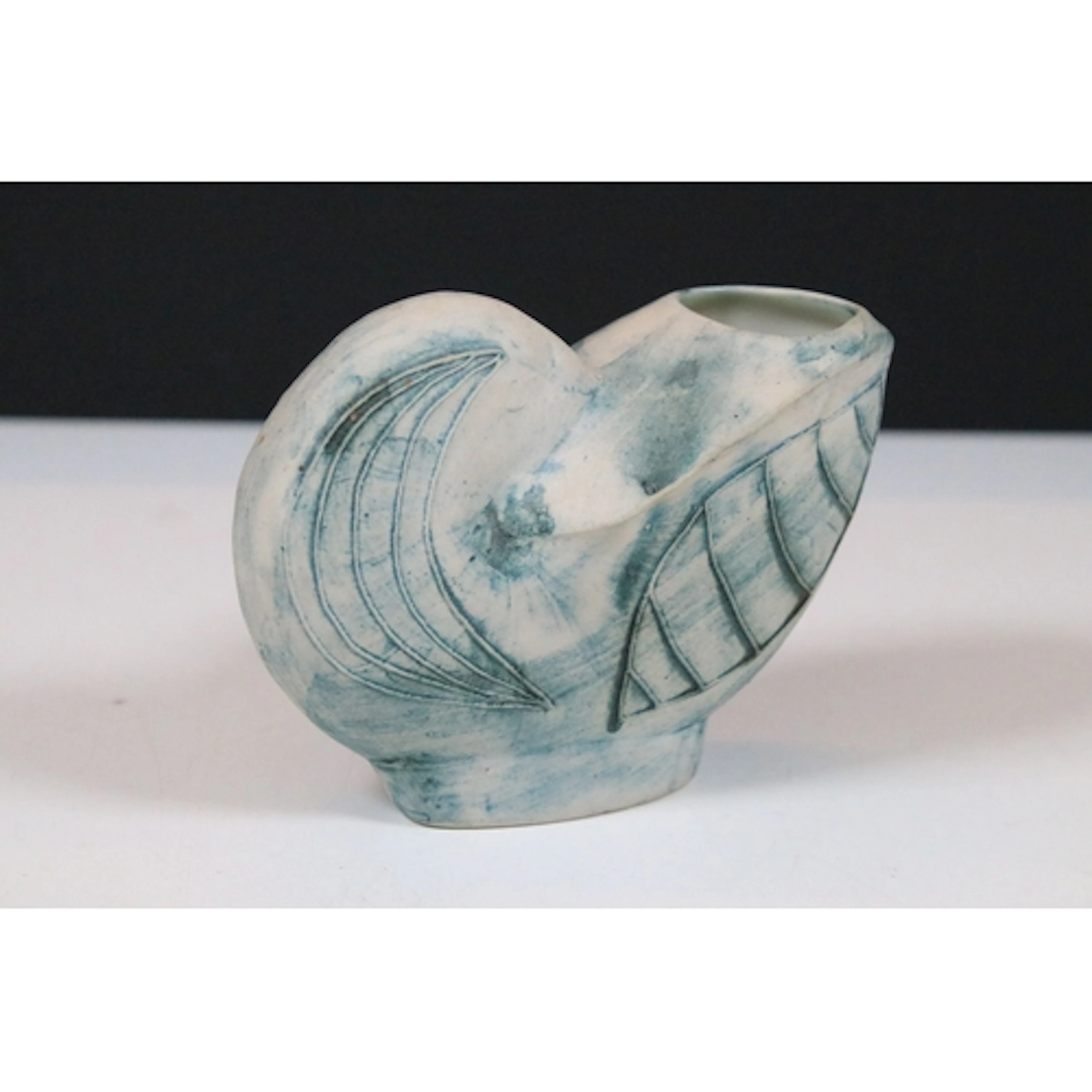 Carn Pottery of Nancledra, Cornwall, a vase of nautilus shel...