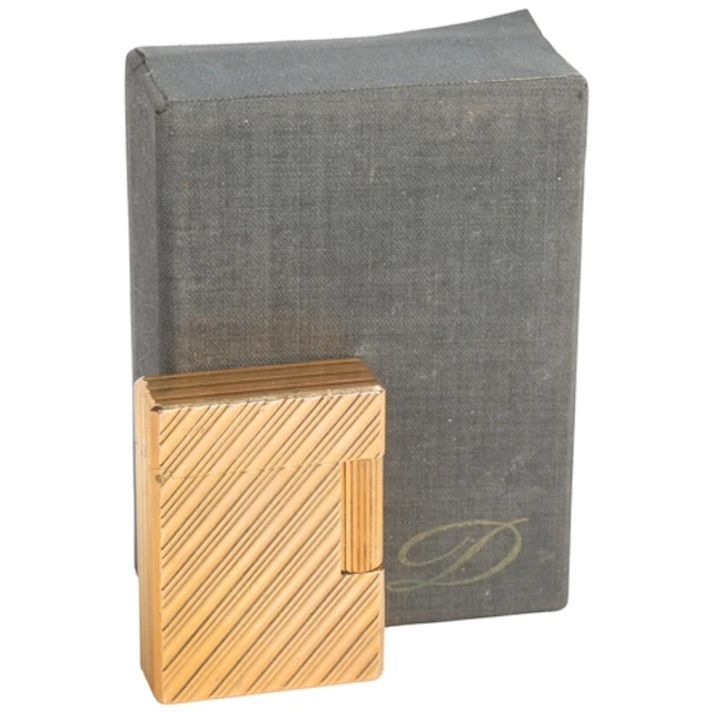 A vintage SJ Dupont lighter, gold plated with makers marks t...