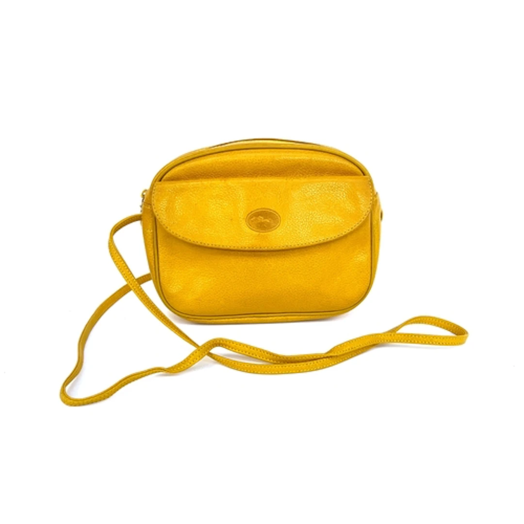 A Longchamp mustard leather crossbody bag, 25cmW