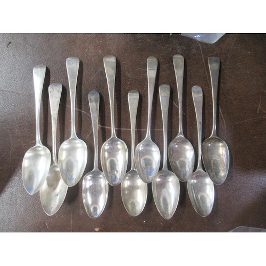 11 various 19th century silver serving spoons, all engraved ...