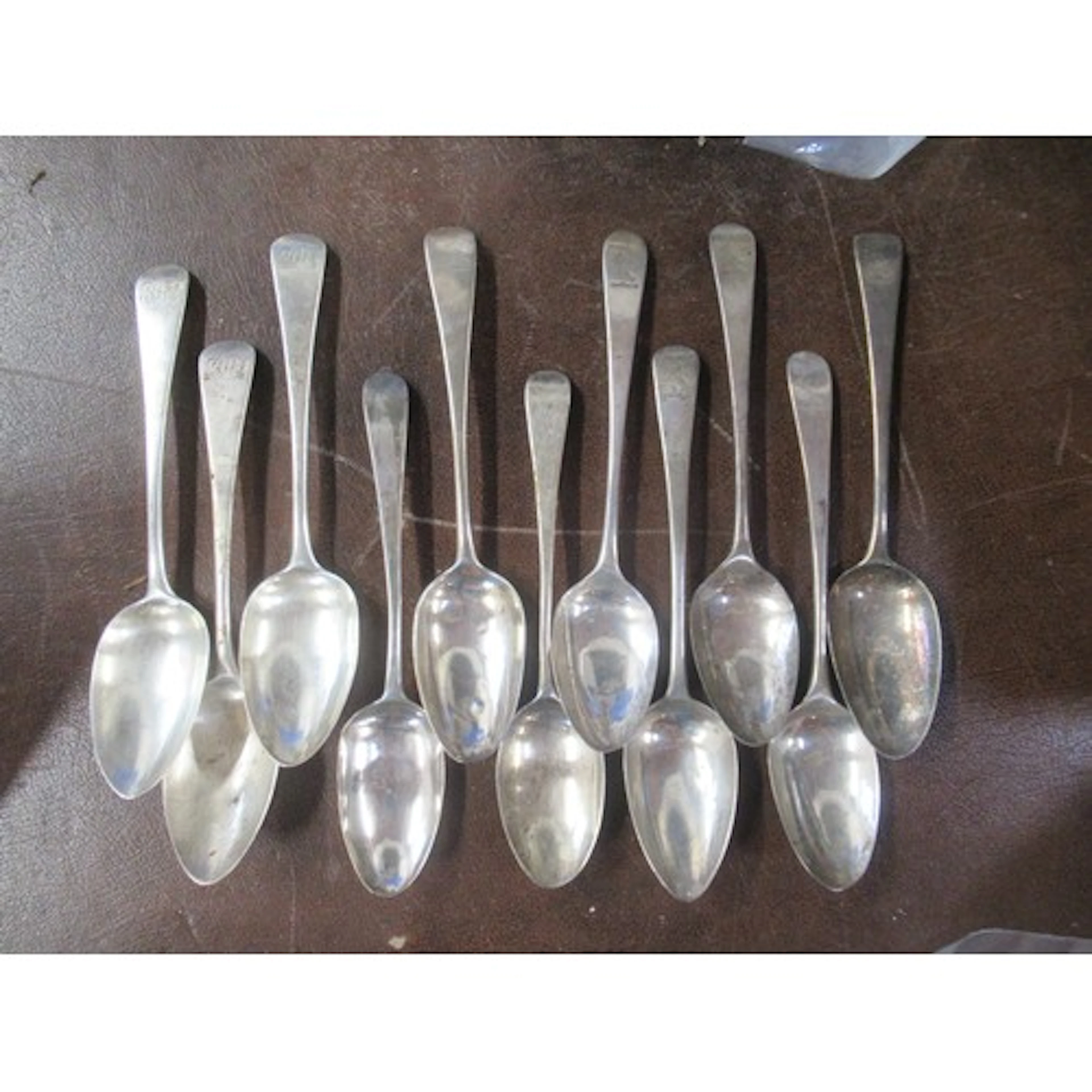 11 various 19th century silver serving spoons, all engraved ...