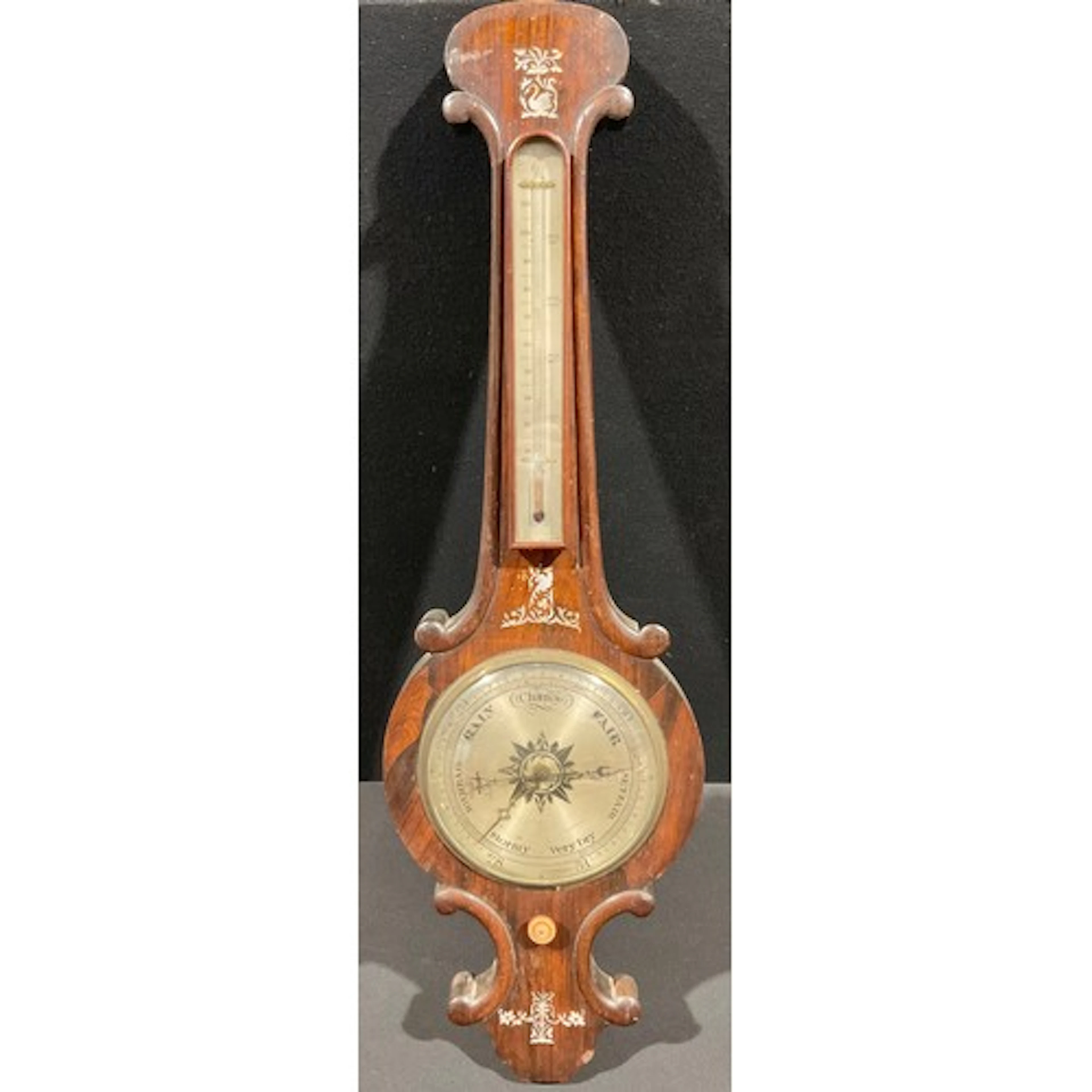 A Victorian rosewood and mother of pearl marquetry wheel bar...