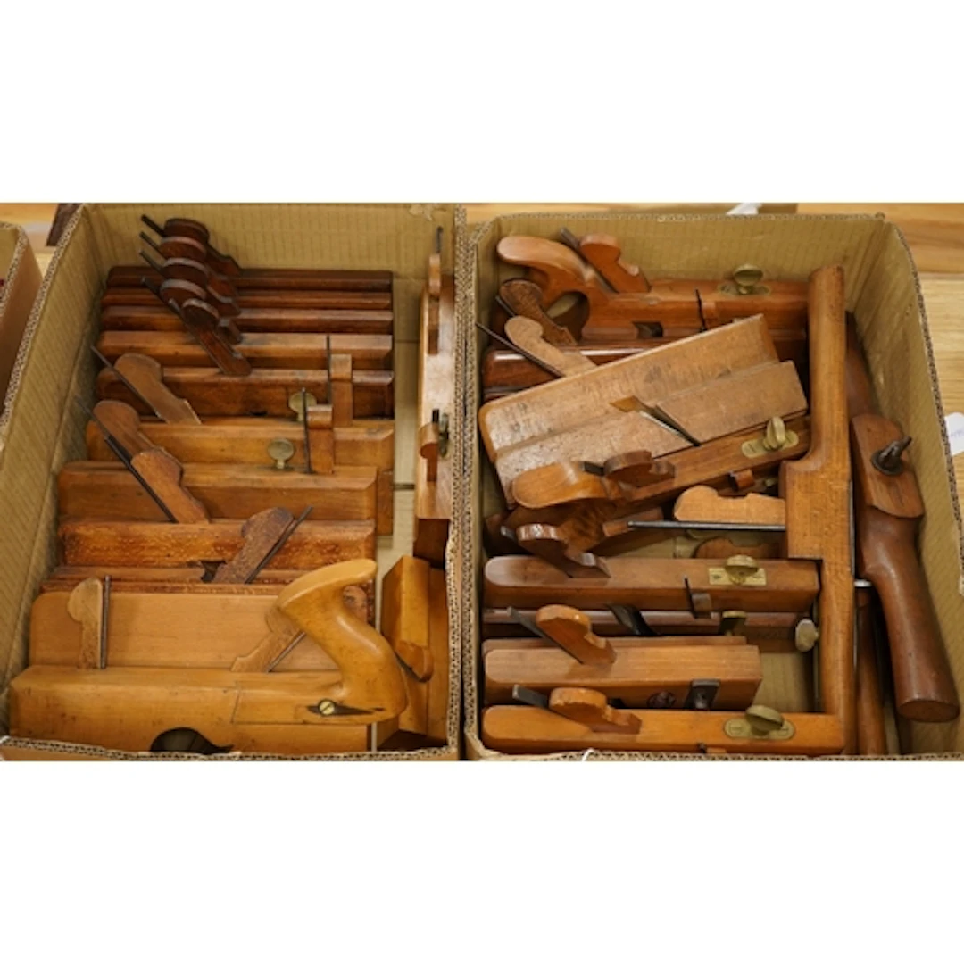 Nineteen 20th century woodworking moulding planes, moving fi...