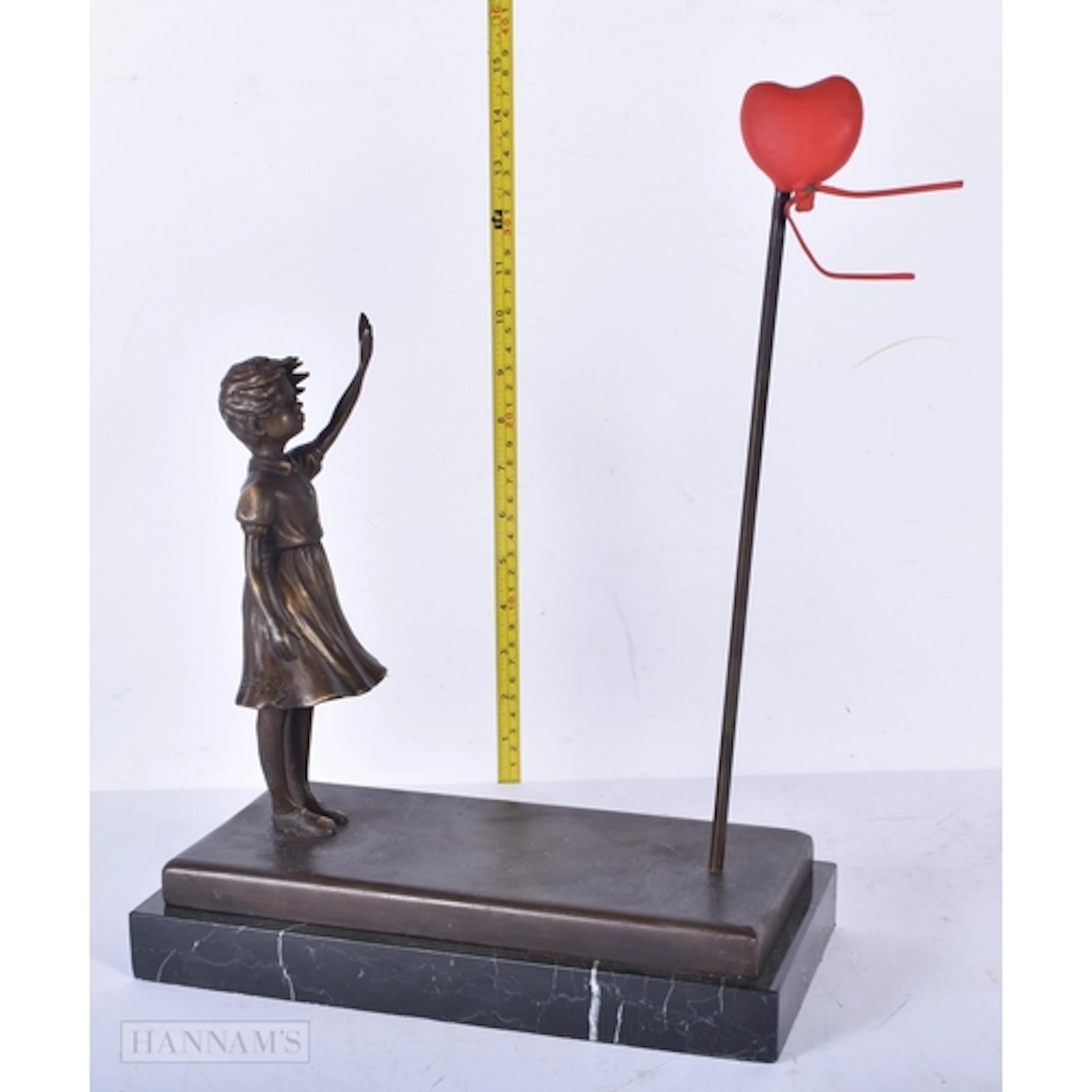 A bronze Banksy style Balloon girl mounted to a marble base ...
