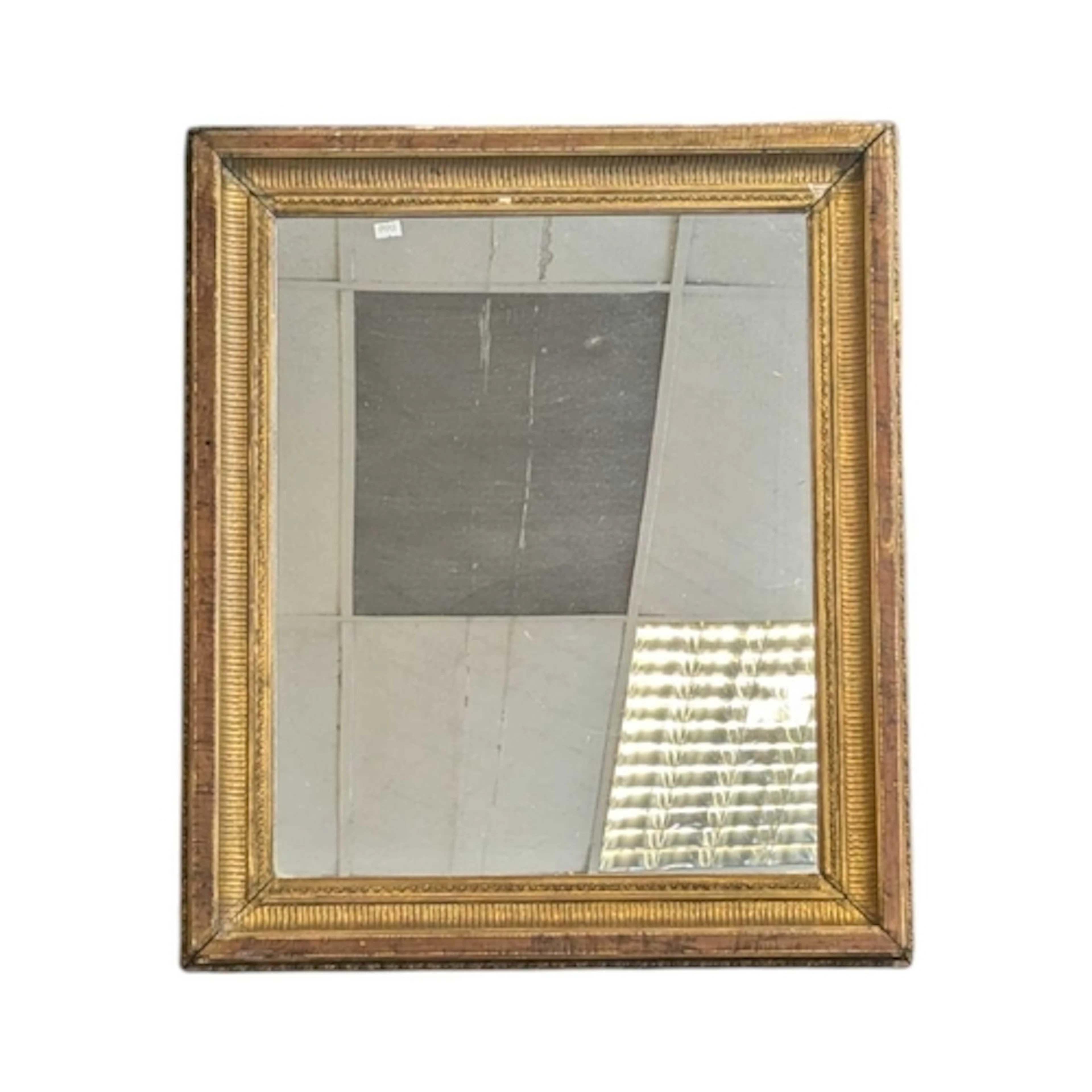 A 19th century Victorian gilt hanging mirror. The mirror of ...