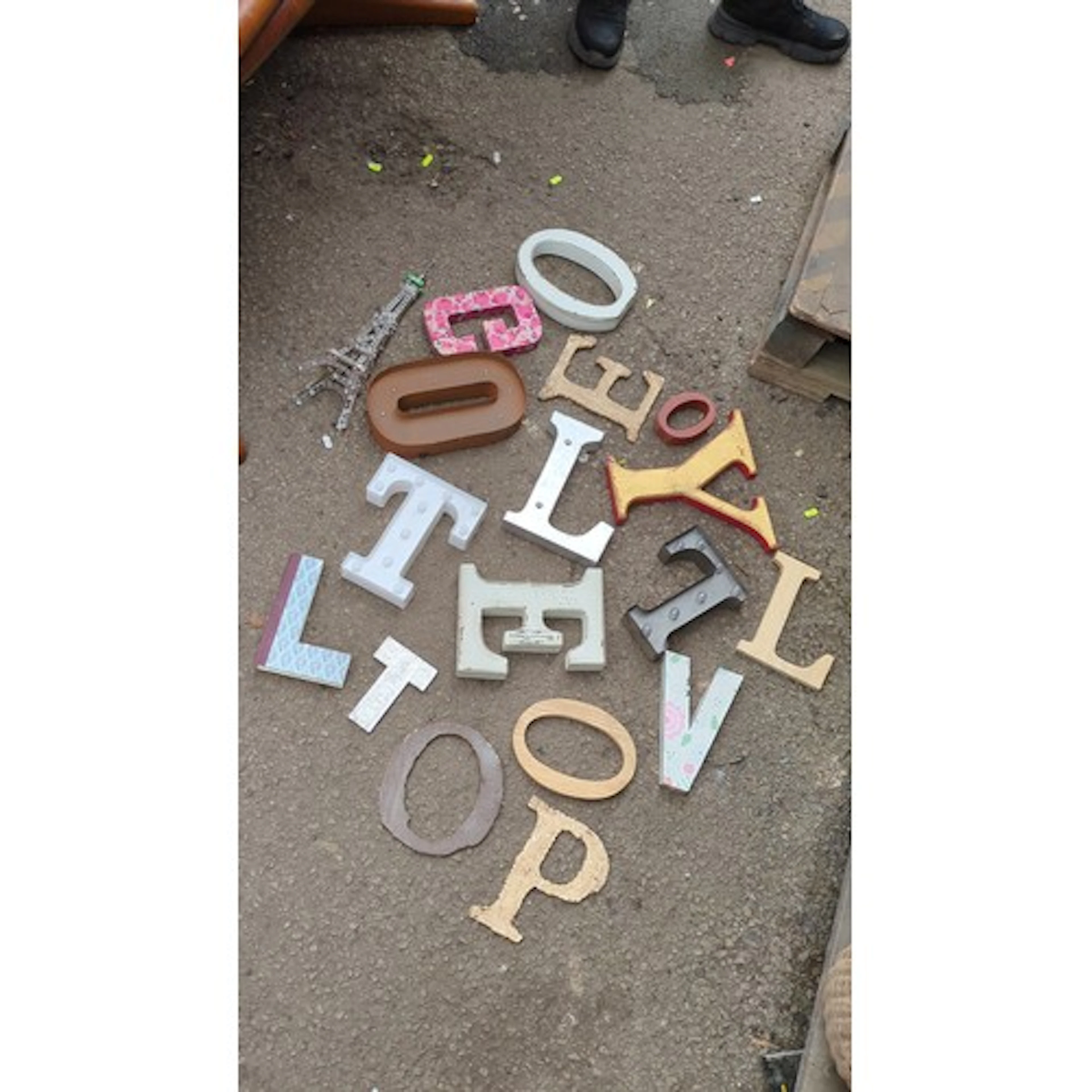 A group of decorative three-dimensional sign letters and sym...