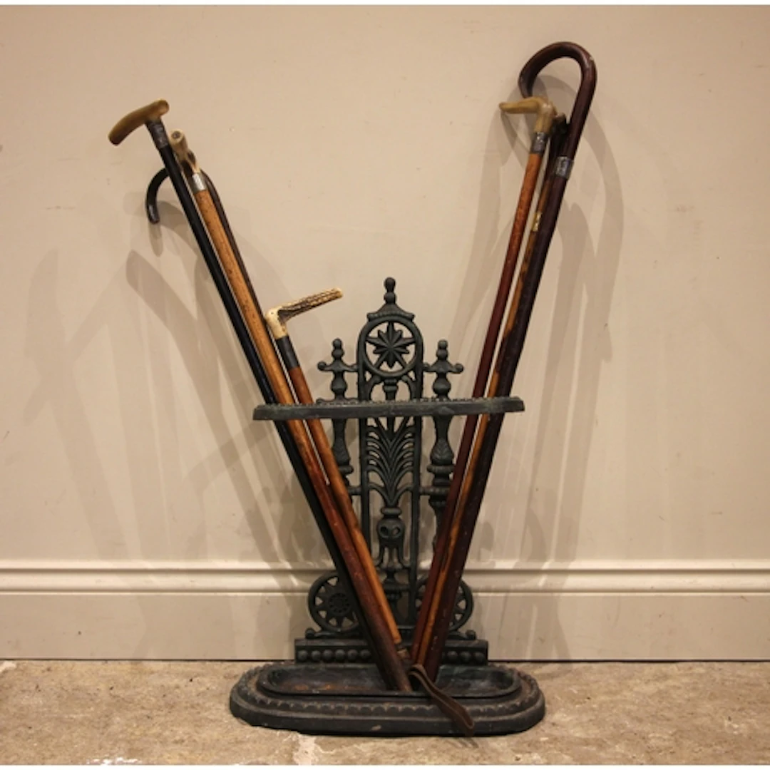 A Victorian cast iron stick stand, of typical form with hoop...