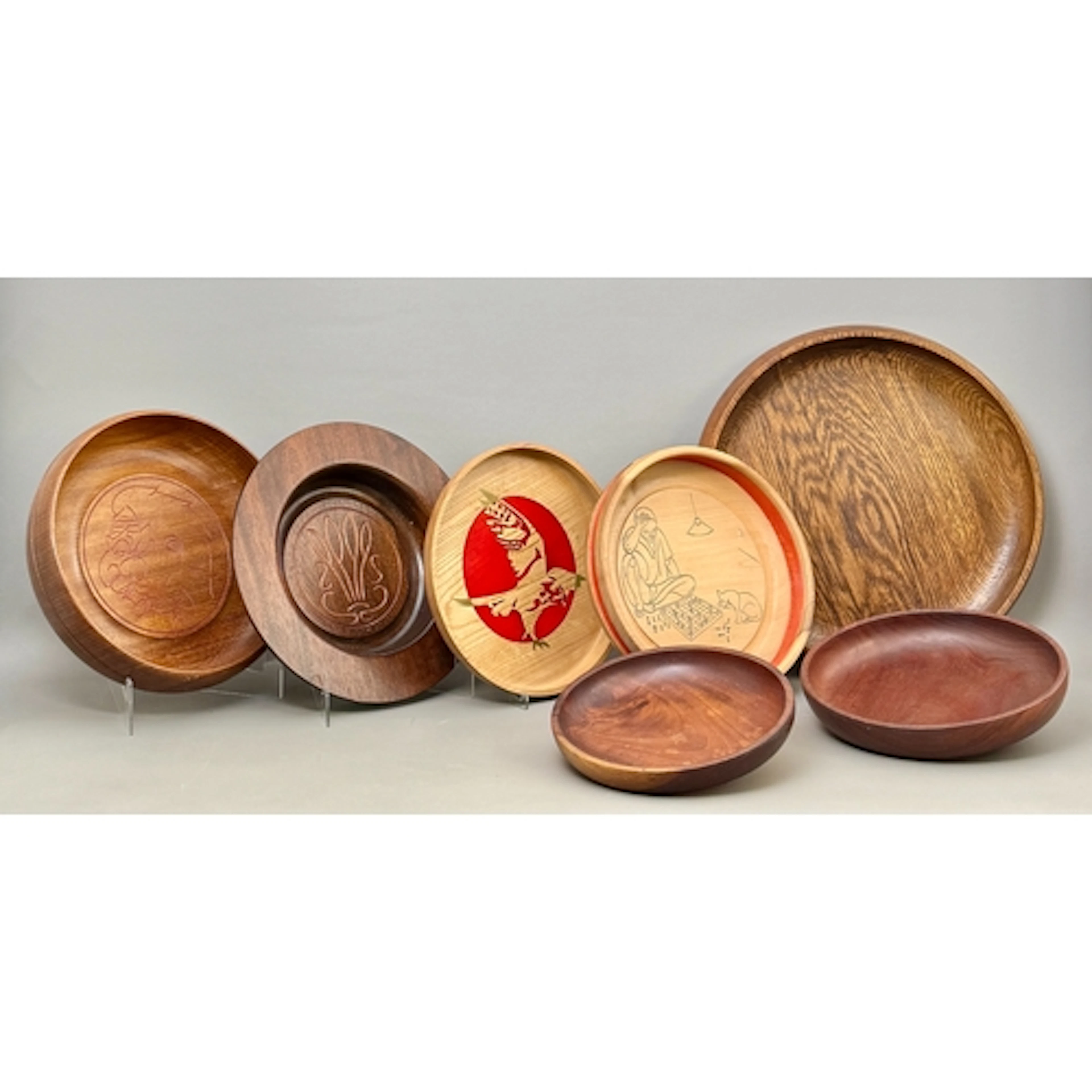 A group of seven turned wood bowls - the largest 43cm diamet...