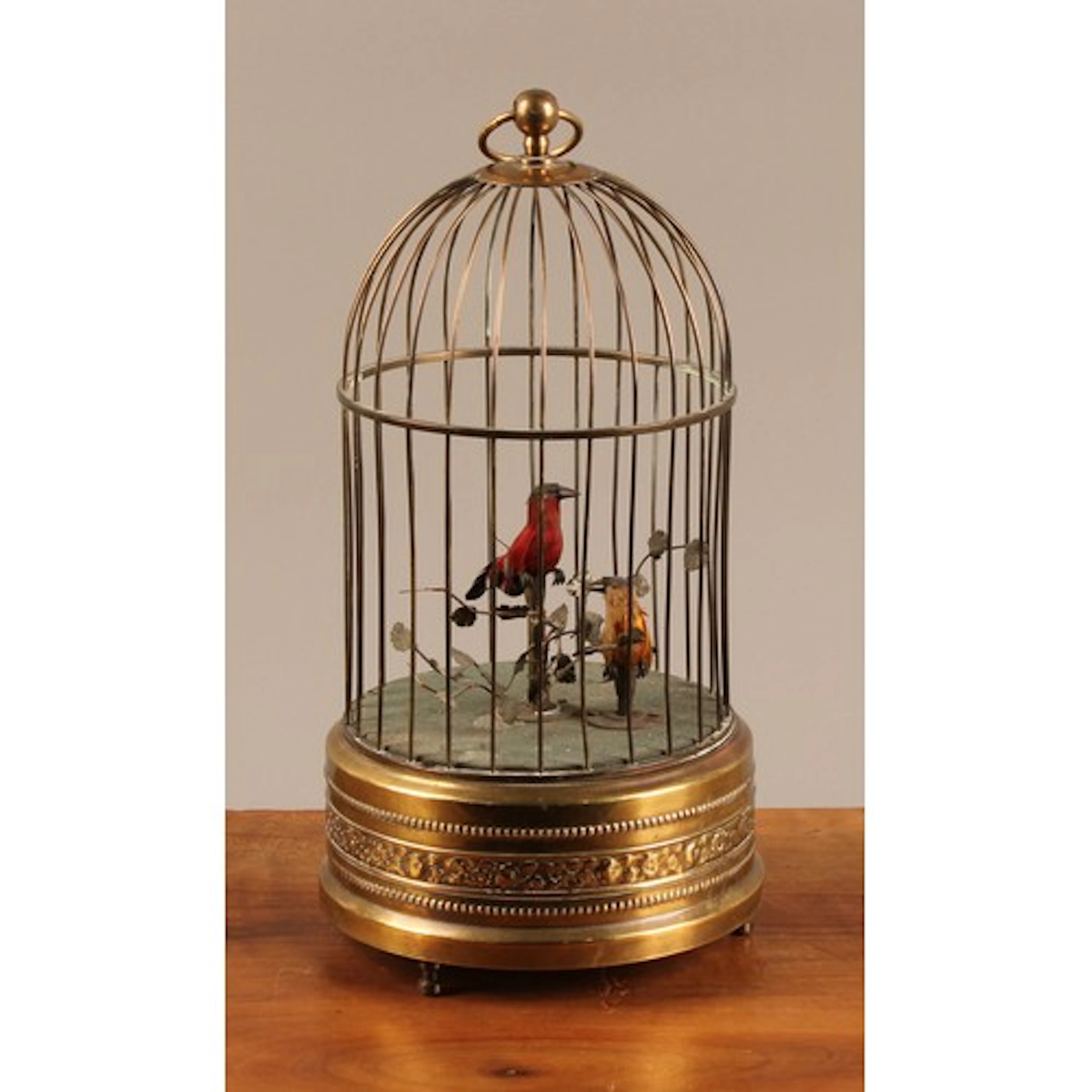 A brass clockwork novelty automaton, as singing birds in a c...