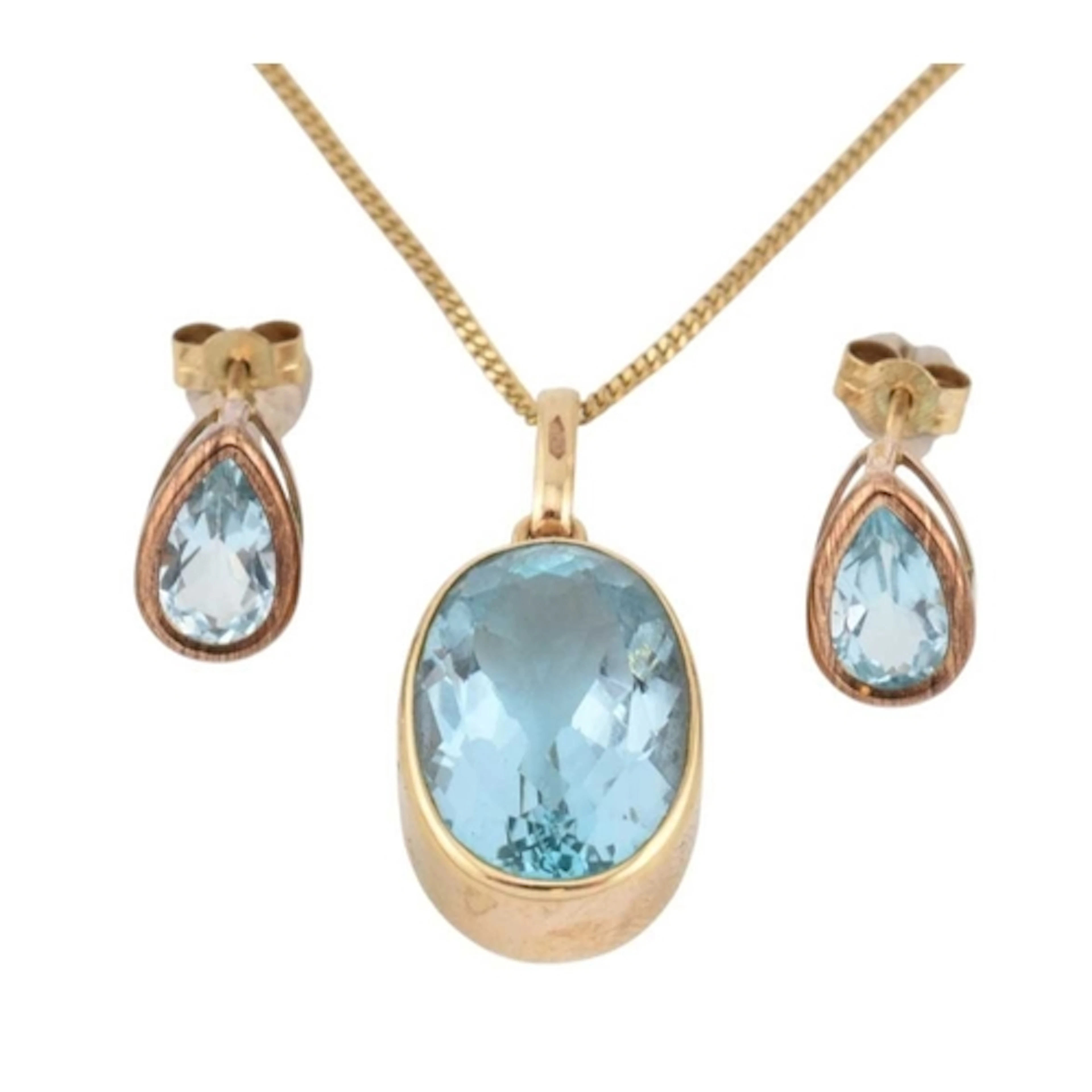 A hallmarked 9ct gold and topaz necklace earring set. Pendan...