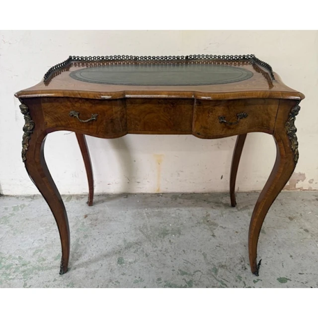 A Louis style walnut veneer writing desk with green leather ...