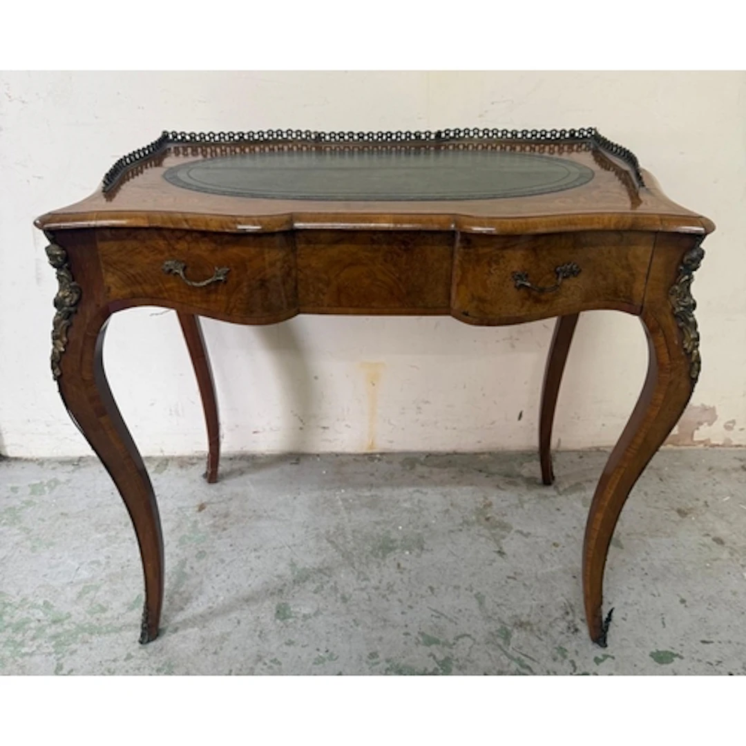 A Louis style walnut veneer writing desk with green leather ...