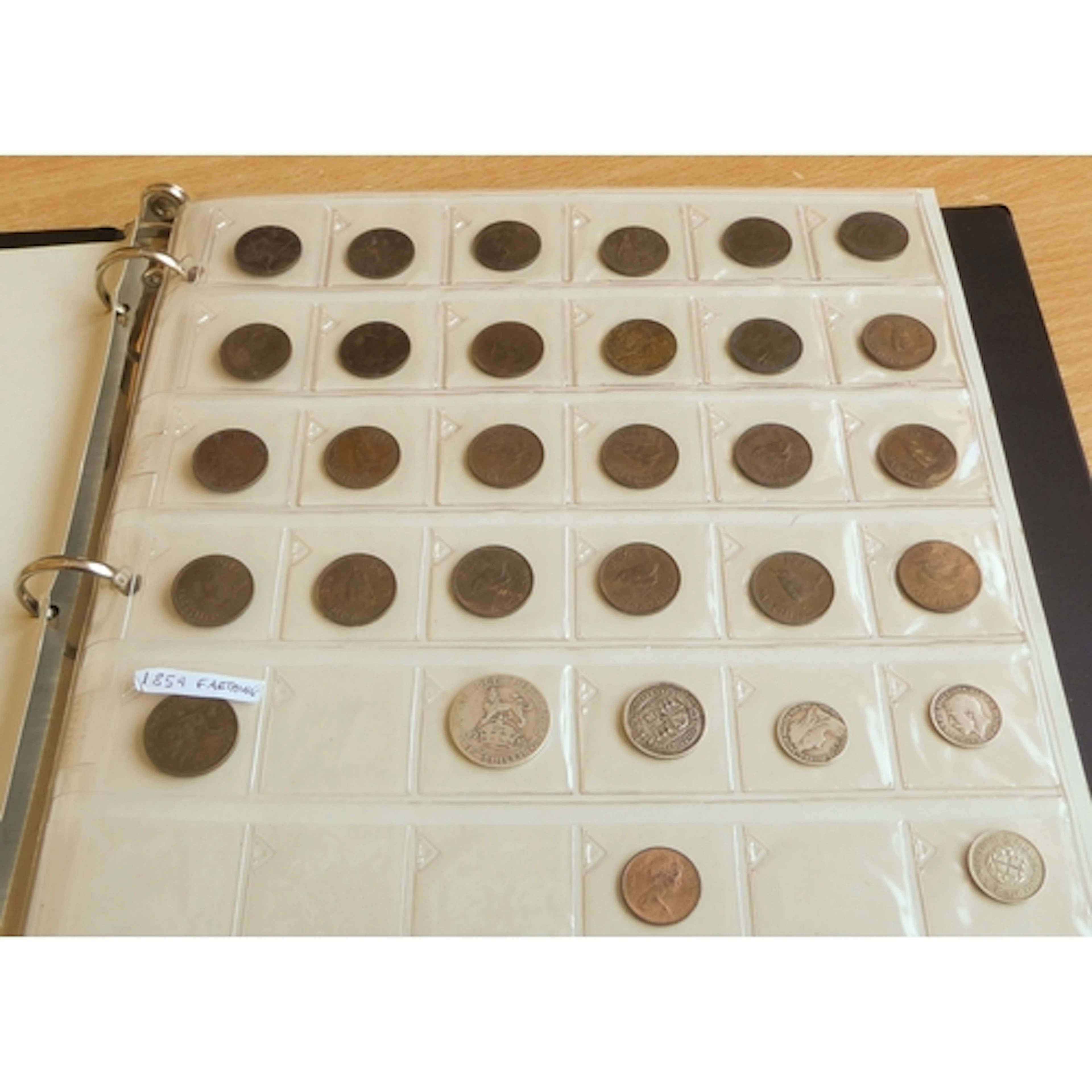 An album of GB and world coins to include: SILVER 1844 cro...