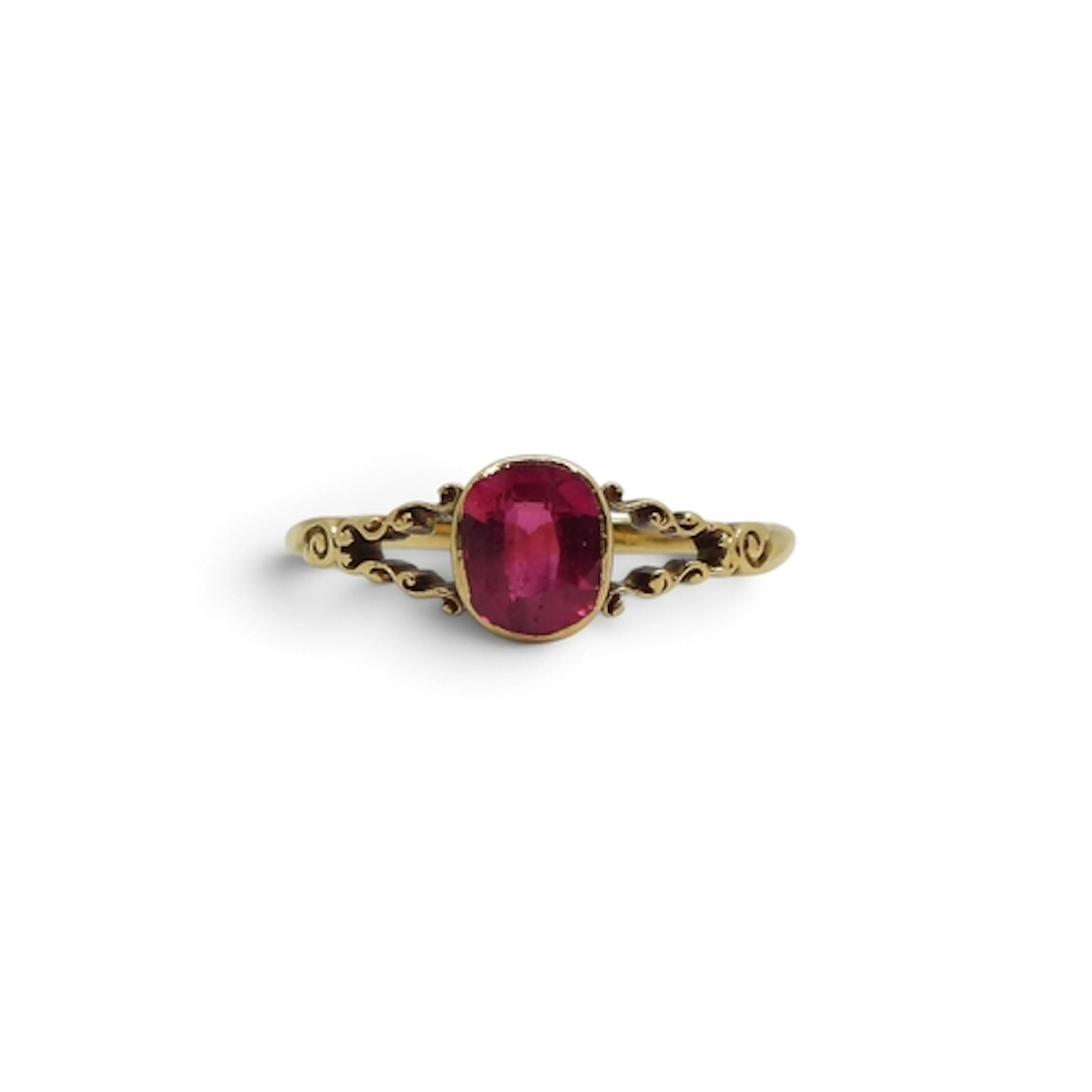 A yellow metal faux ruby ring with scroll mount, size O, wei...