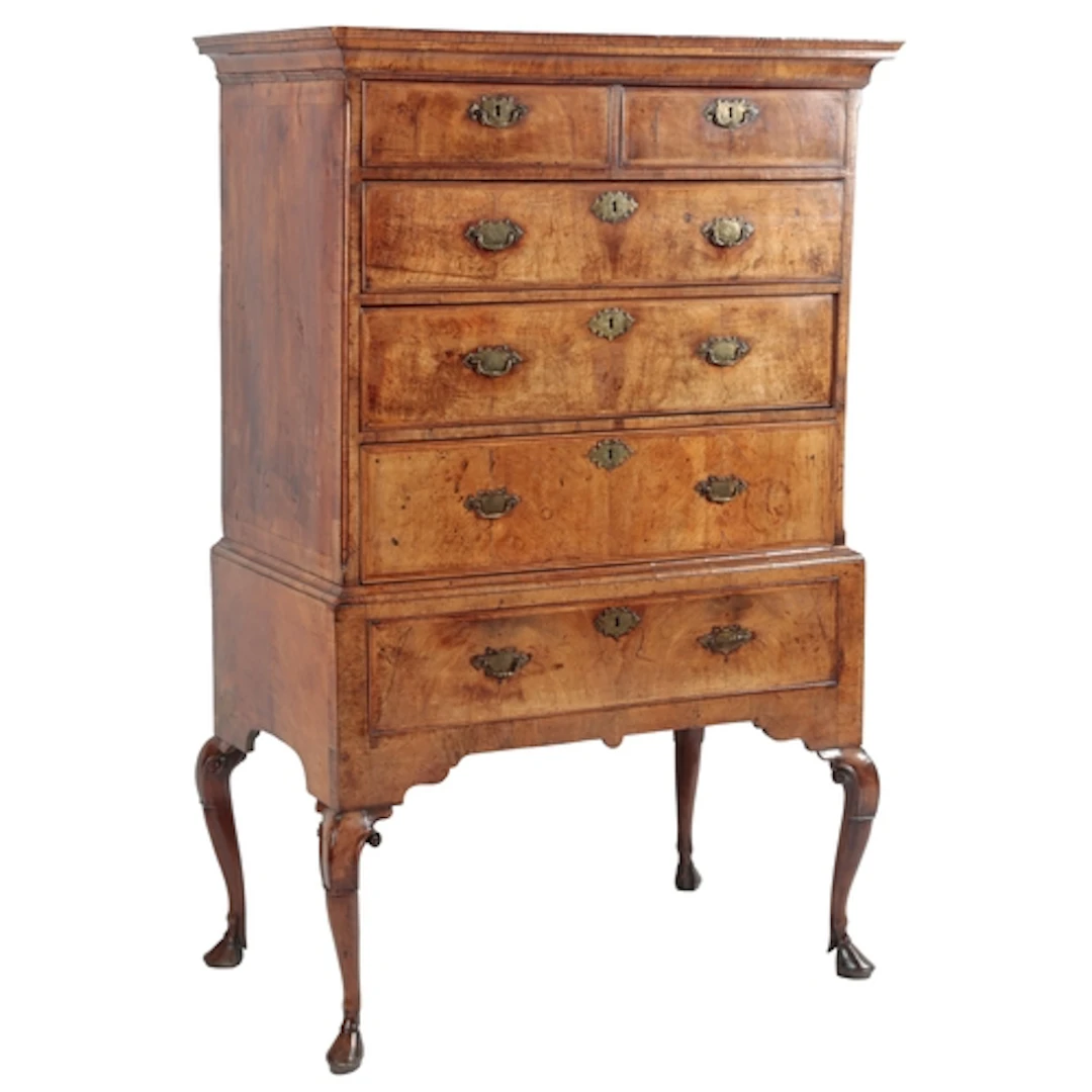 A George II figured walnut chest on stand, the moulded overh...