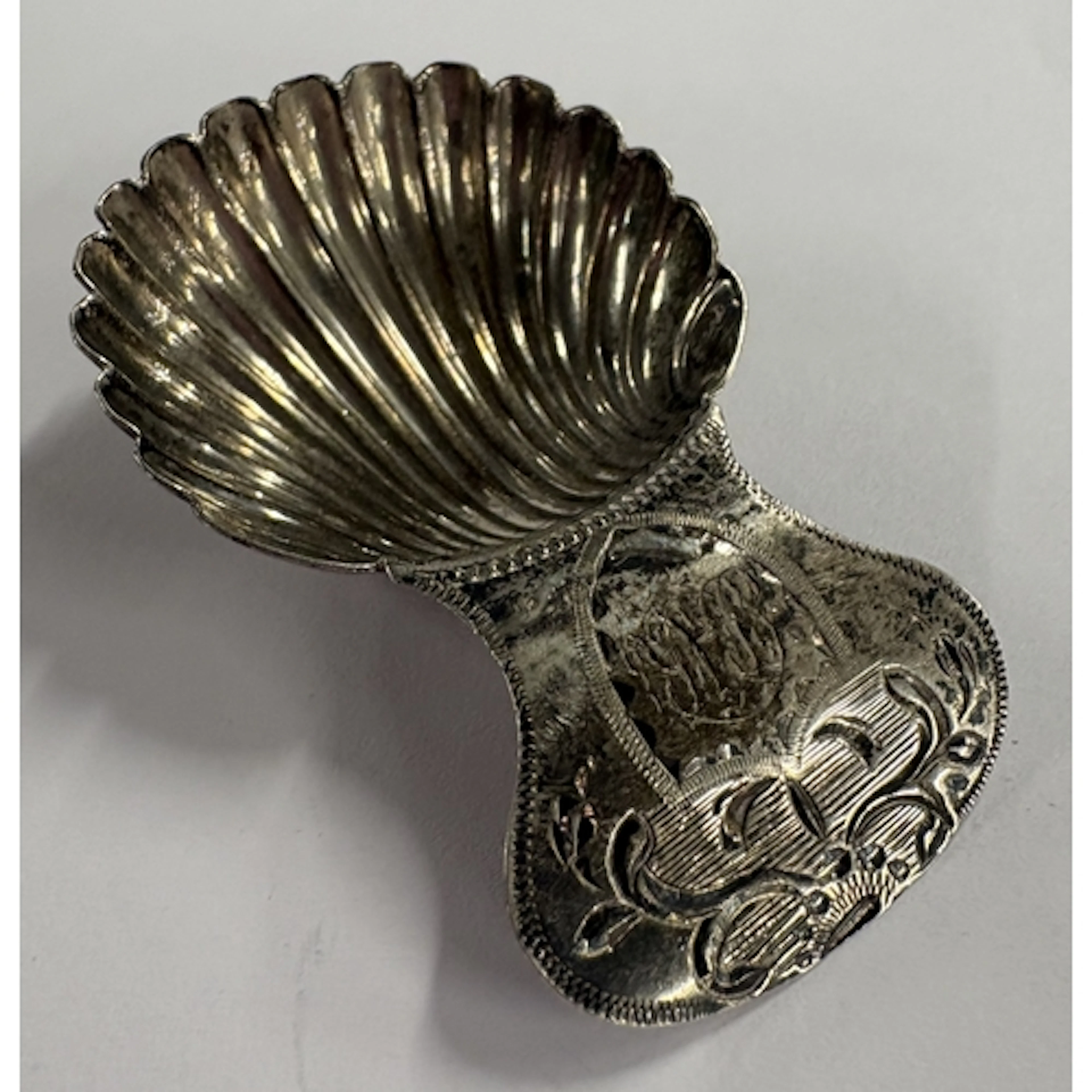 An 18th Century silver caddy spoon with bright-cut decoratio...