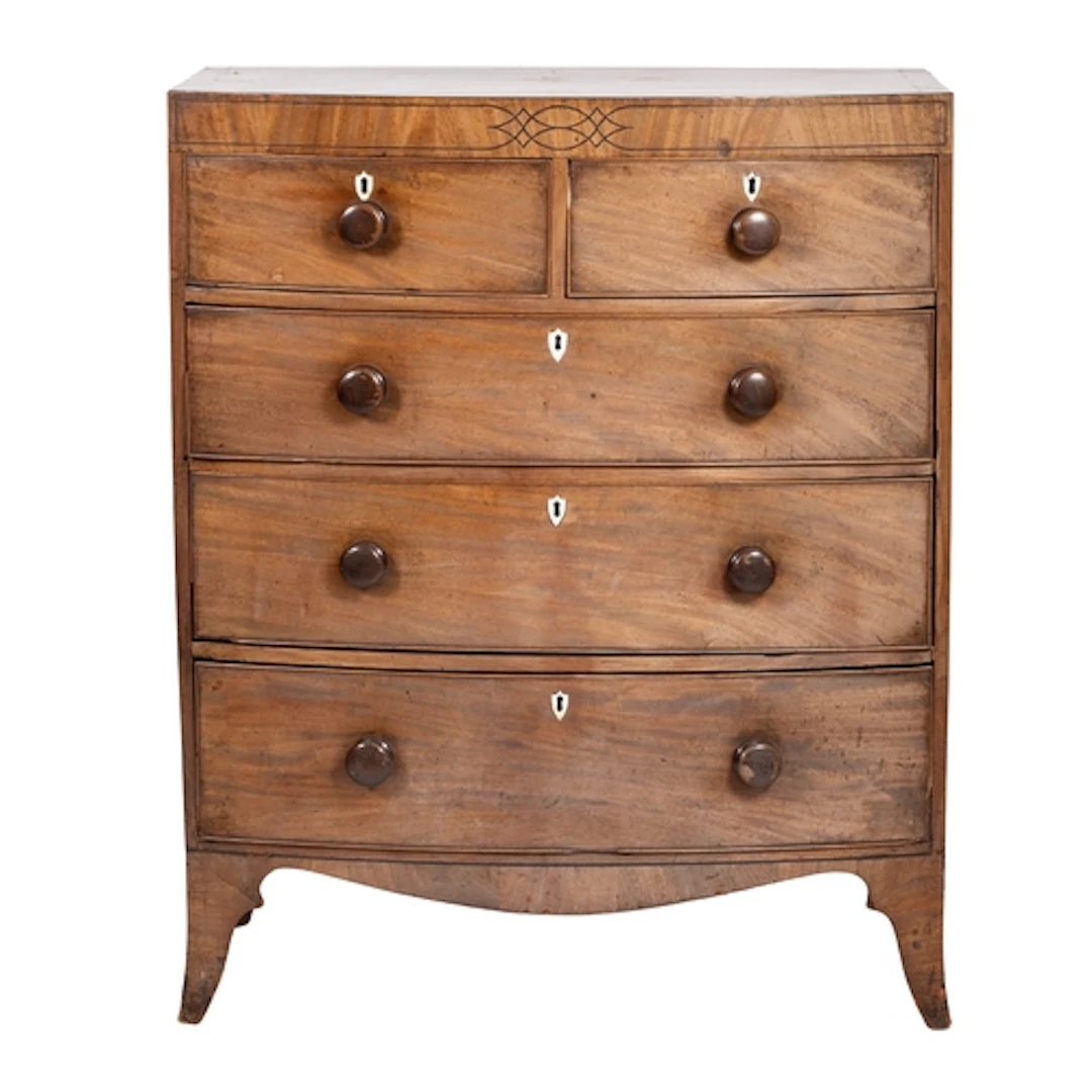A Regency mahogany and line-inlaid bowfront chest of drawers...