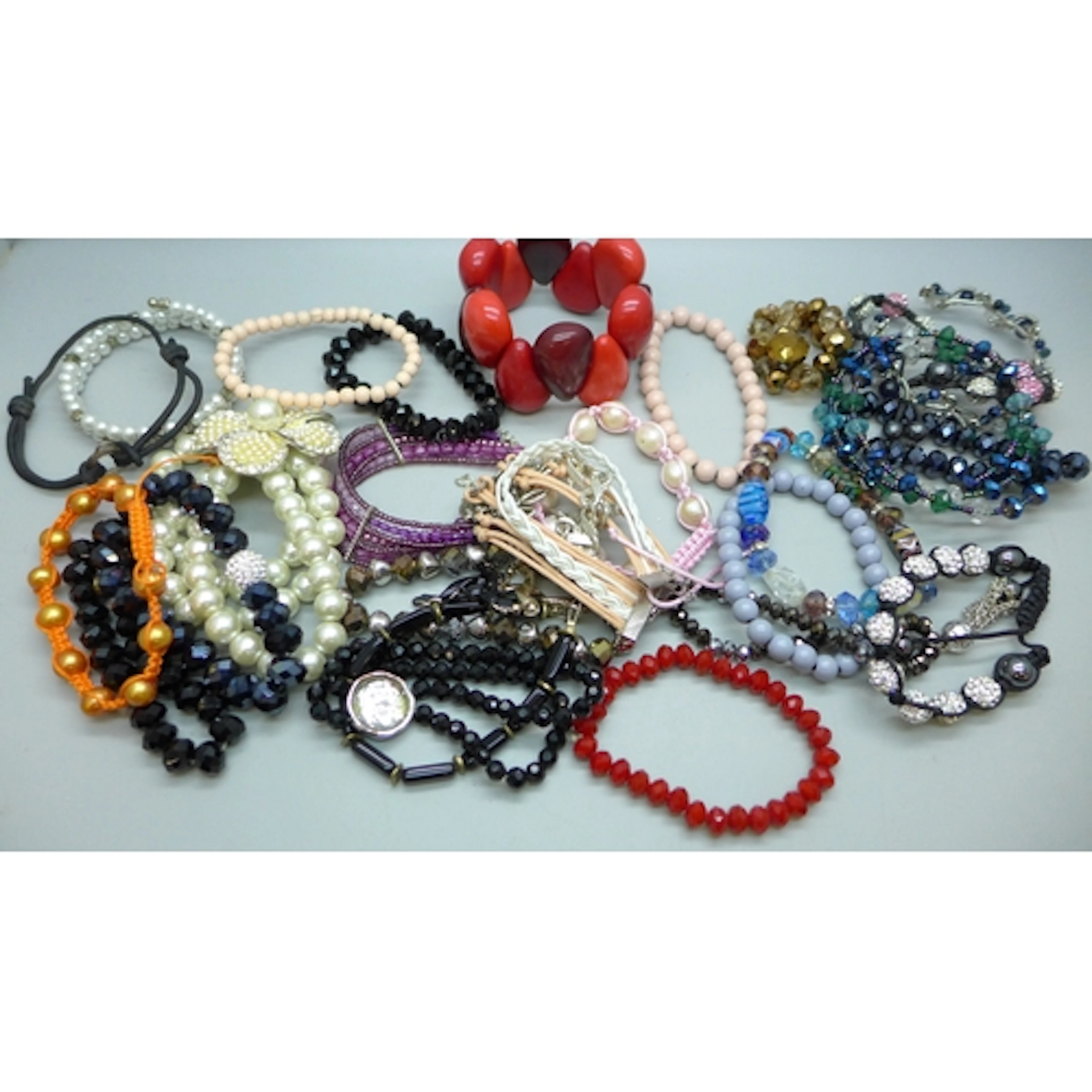 A collection of costume bracelets including one with disc ma...