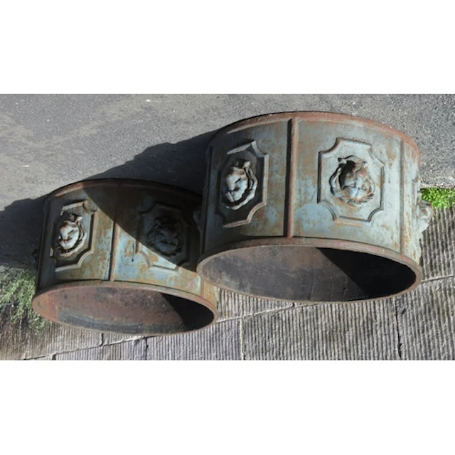 A pair of cast iron circular planters, of cylindrical form, ...