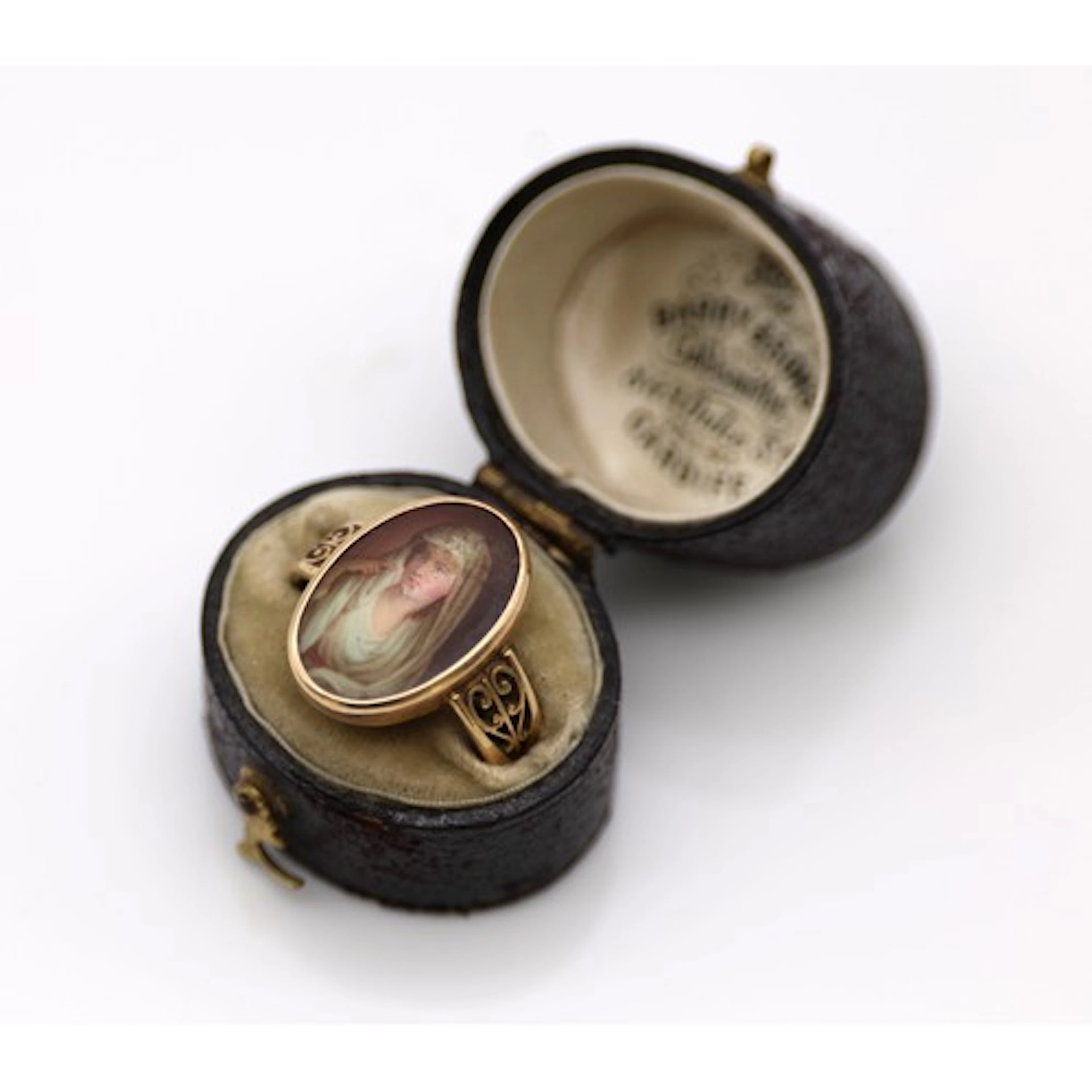A 19th century painted miniature portrait ring, depicting a ...