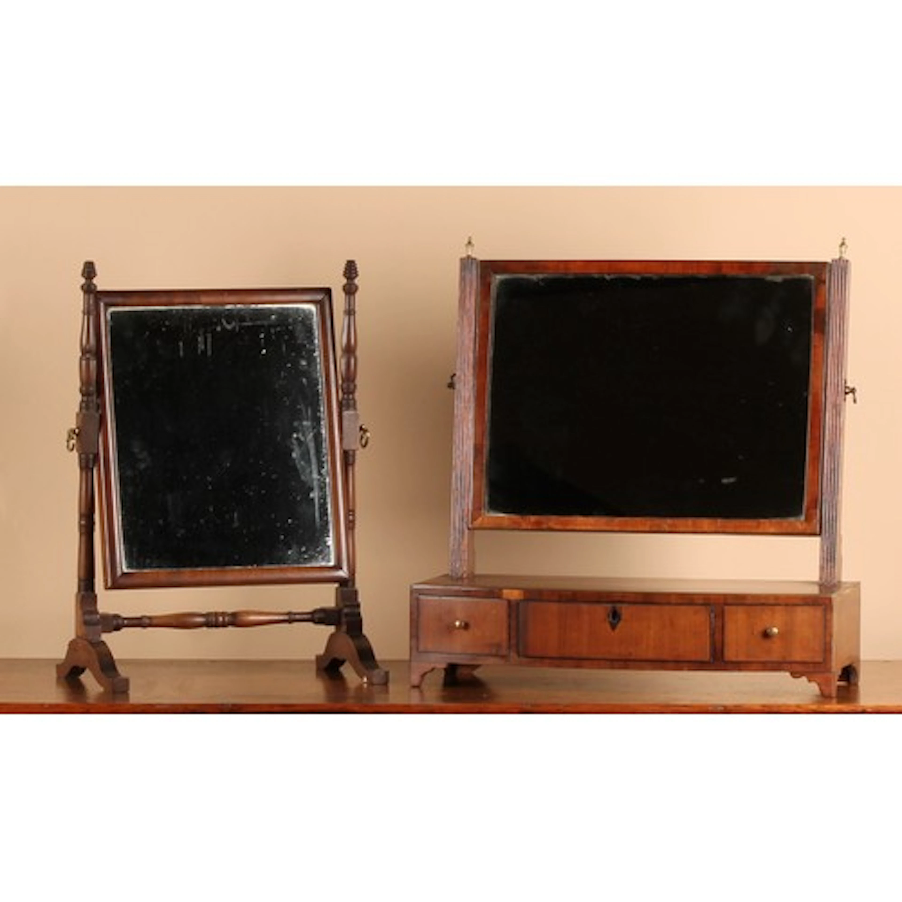 A Regency mahogany dressing glass, rectangular mirror plate,...