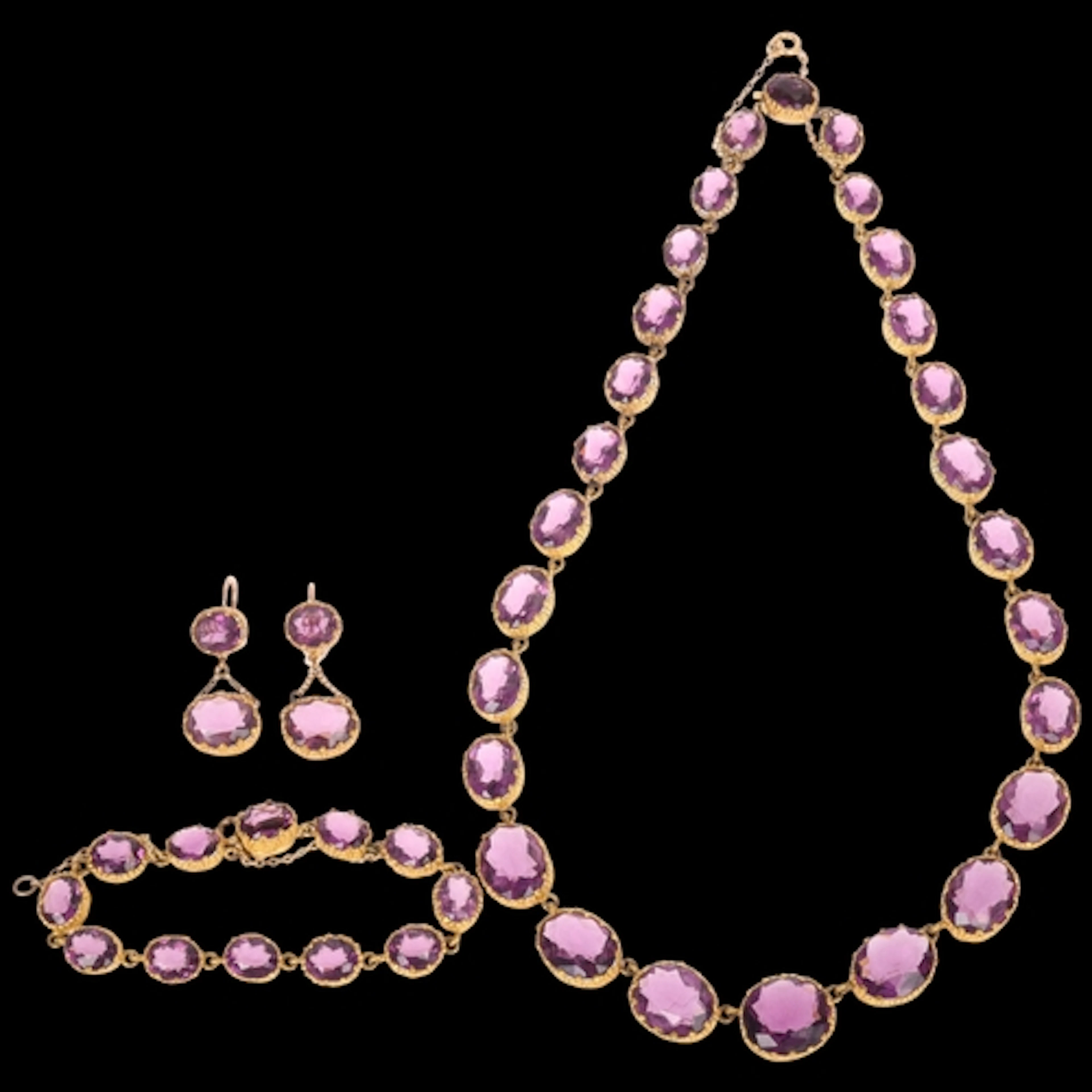 An Antique gilt-metal amethyst paste demi-parure, comprising...