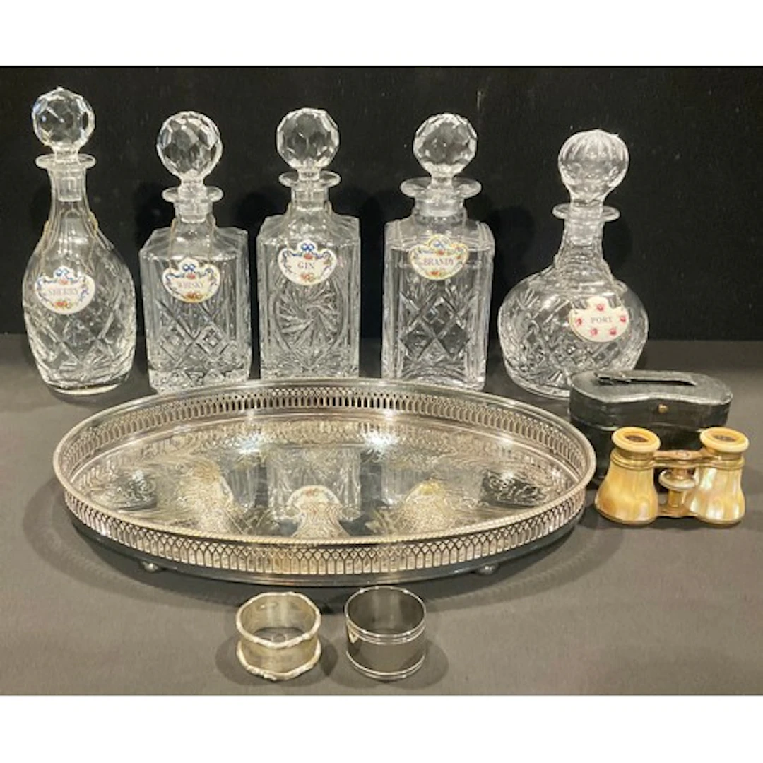 A collection of six cut glass decanters, various shapes; a s...